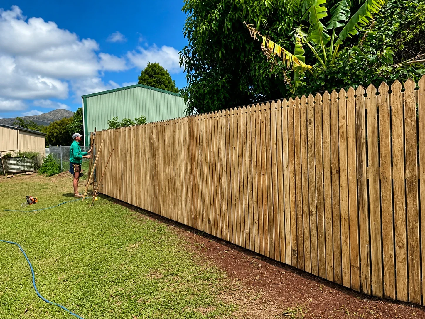 Timber paling boundary fence installed on a rural property in the Atherton Tablelands