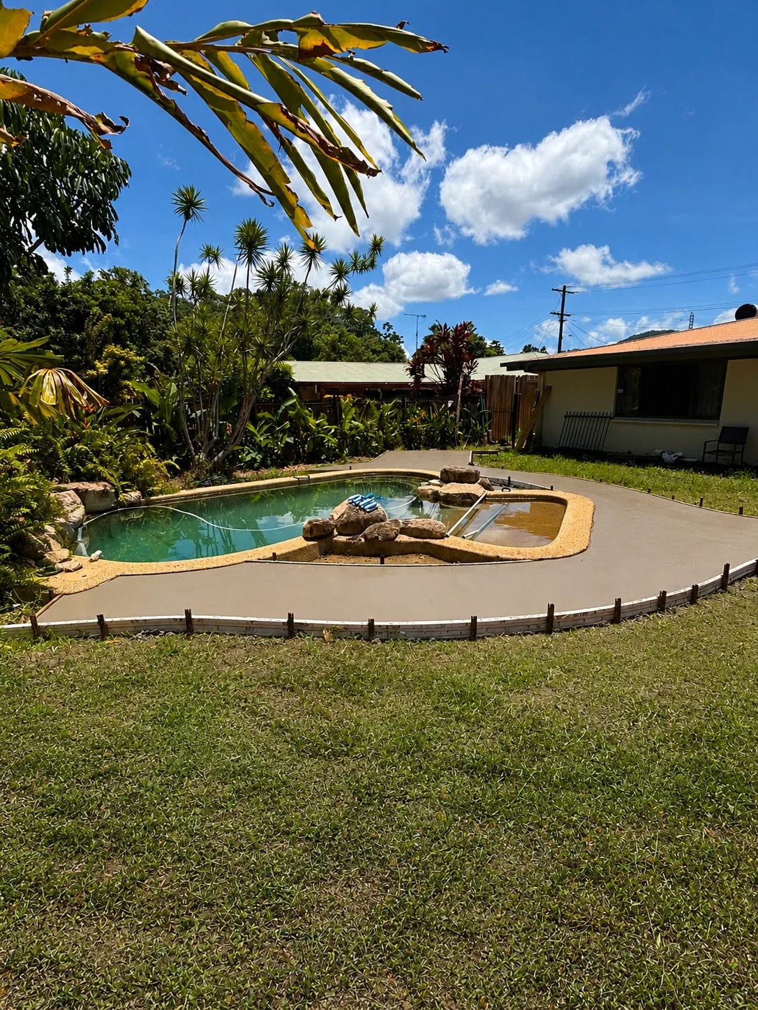 Newly poured concrete pool surround at a residential property in Cairns