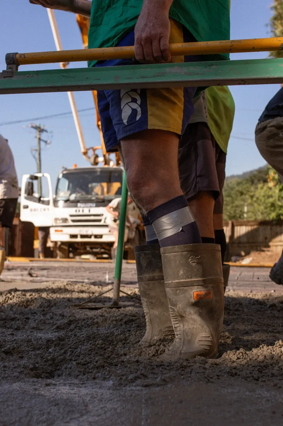 Concrete slab being poured and finished by concreters in Far North Queensland.