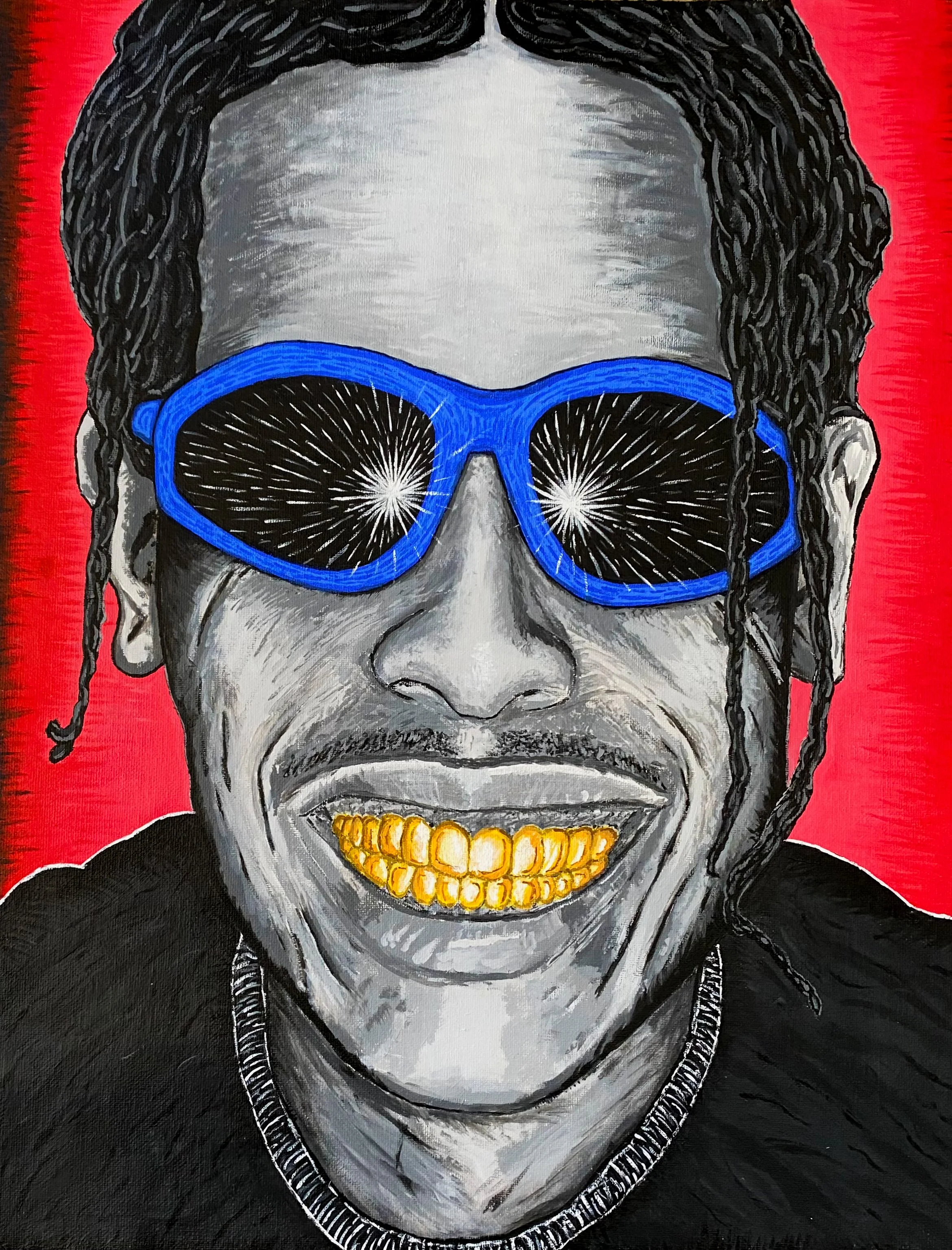 Portrait of a A$AP Rocky wearing blue sunglasses, showing gold teeth, with a red background.