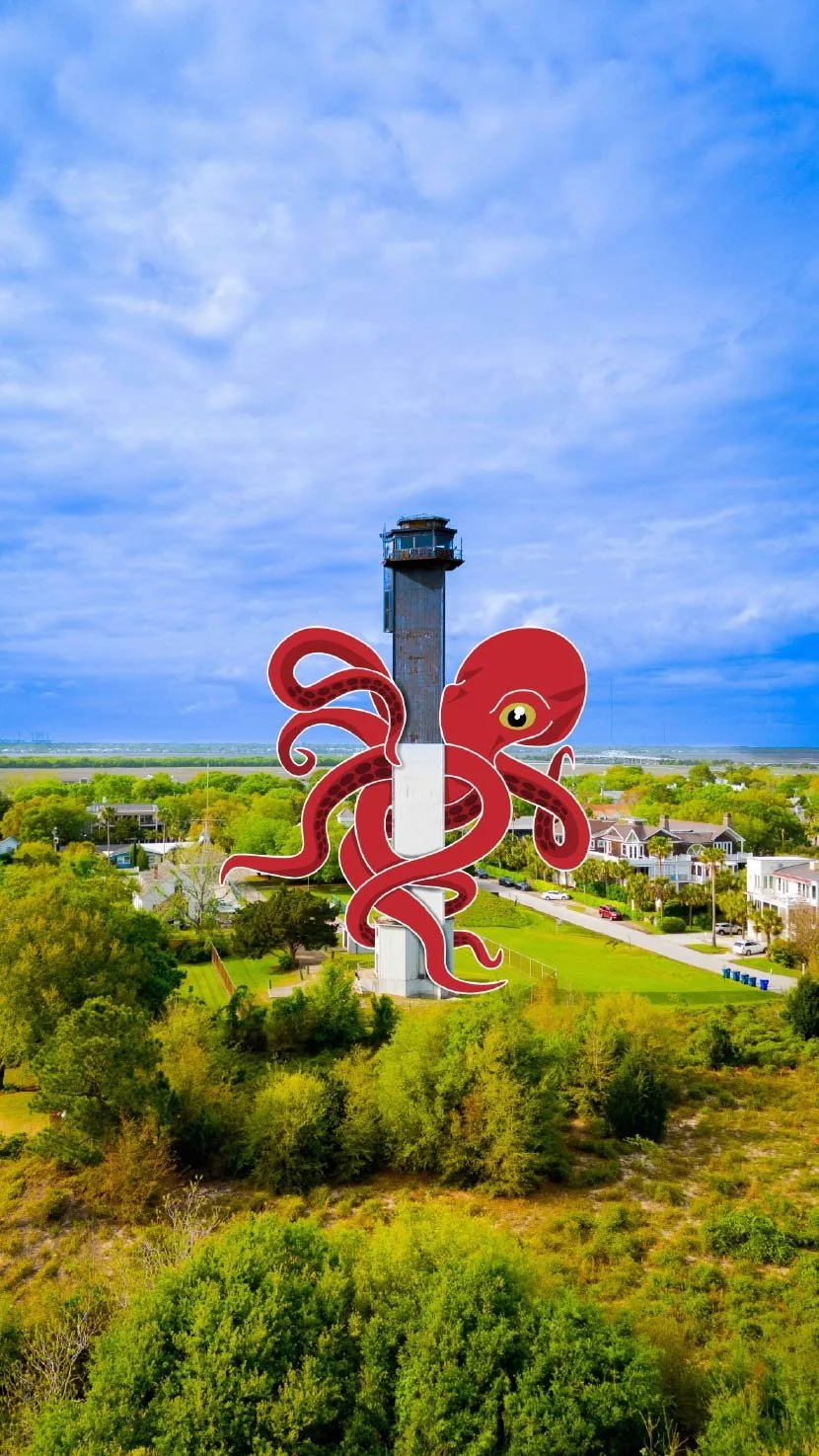 Large digital octopus on a tall lighthouse, located in a green residential area with houses and trees, under a blue sky.