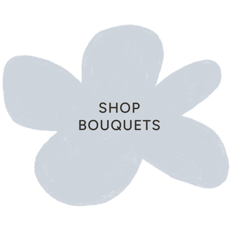 Light blue flower-shaped sign with text 'Shop Bouquets' in the center.
