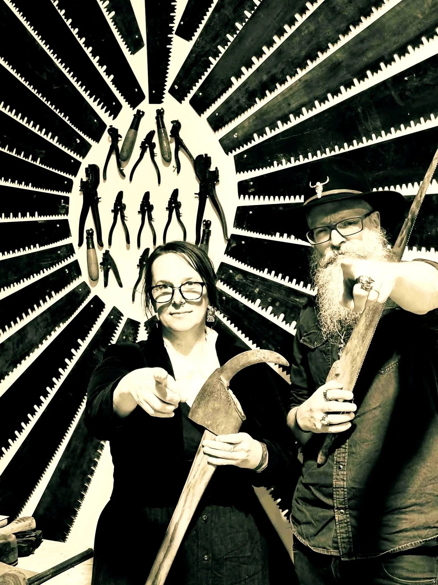Goldfields Gothic Festival Of Dark Ideas 2026.  One Part Gin.  Holly Sewell and Sam Bell standing in front of a saw display.