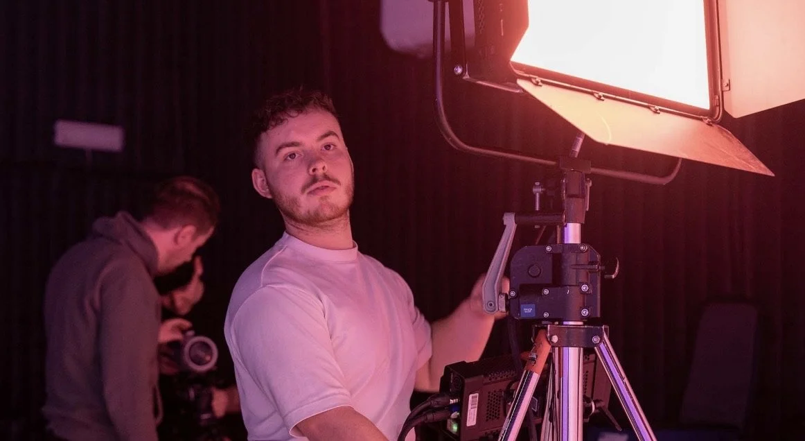 Luther M E Bottrill Adjusting Lighting on a video shoot