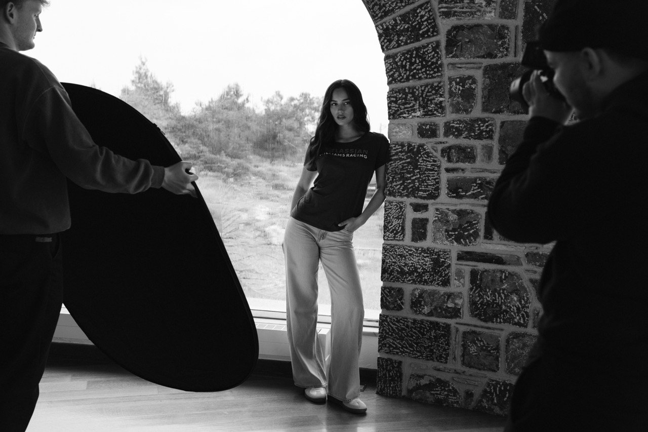 Black and white behind the scenes image of a formula one photoshoot