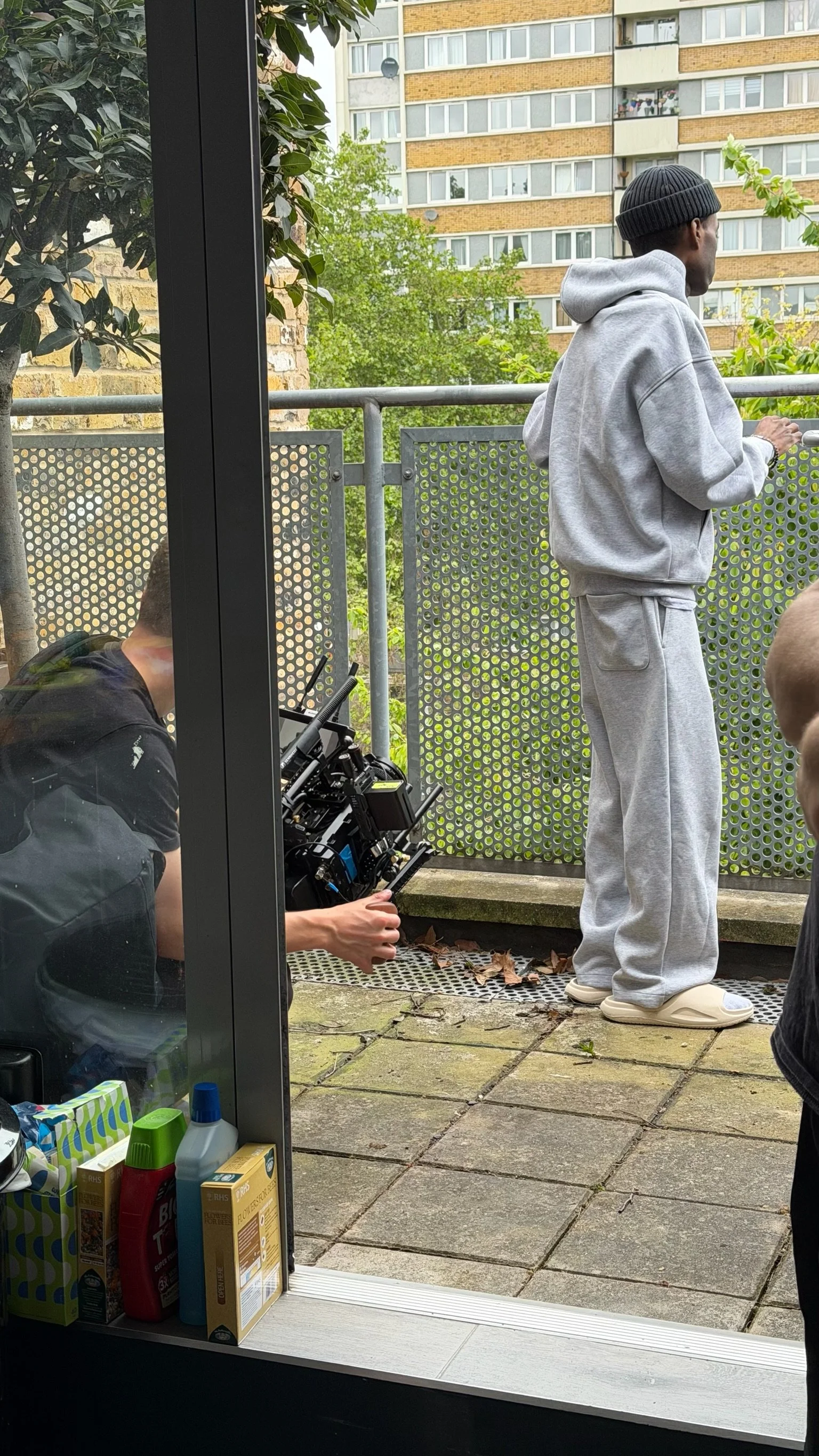 Roy filmed at home for the Sarcoma UK Support Line campaign, phone in hand, LutherMEB Productions London