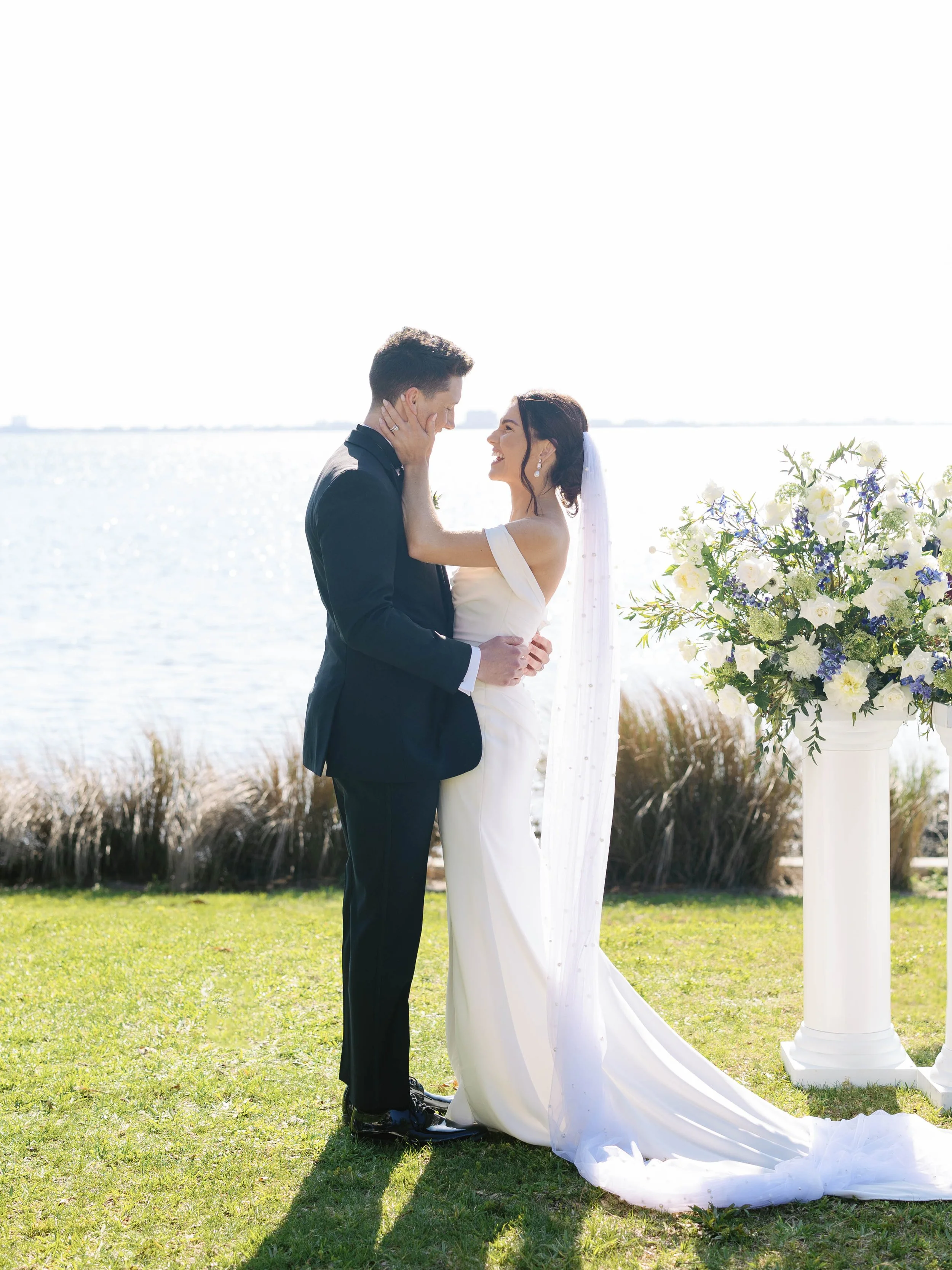 Bride and Groom with blue and white wedding flowers