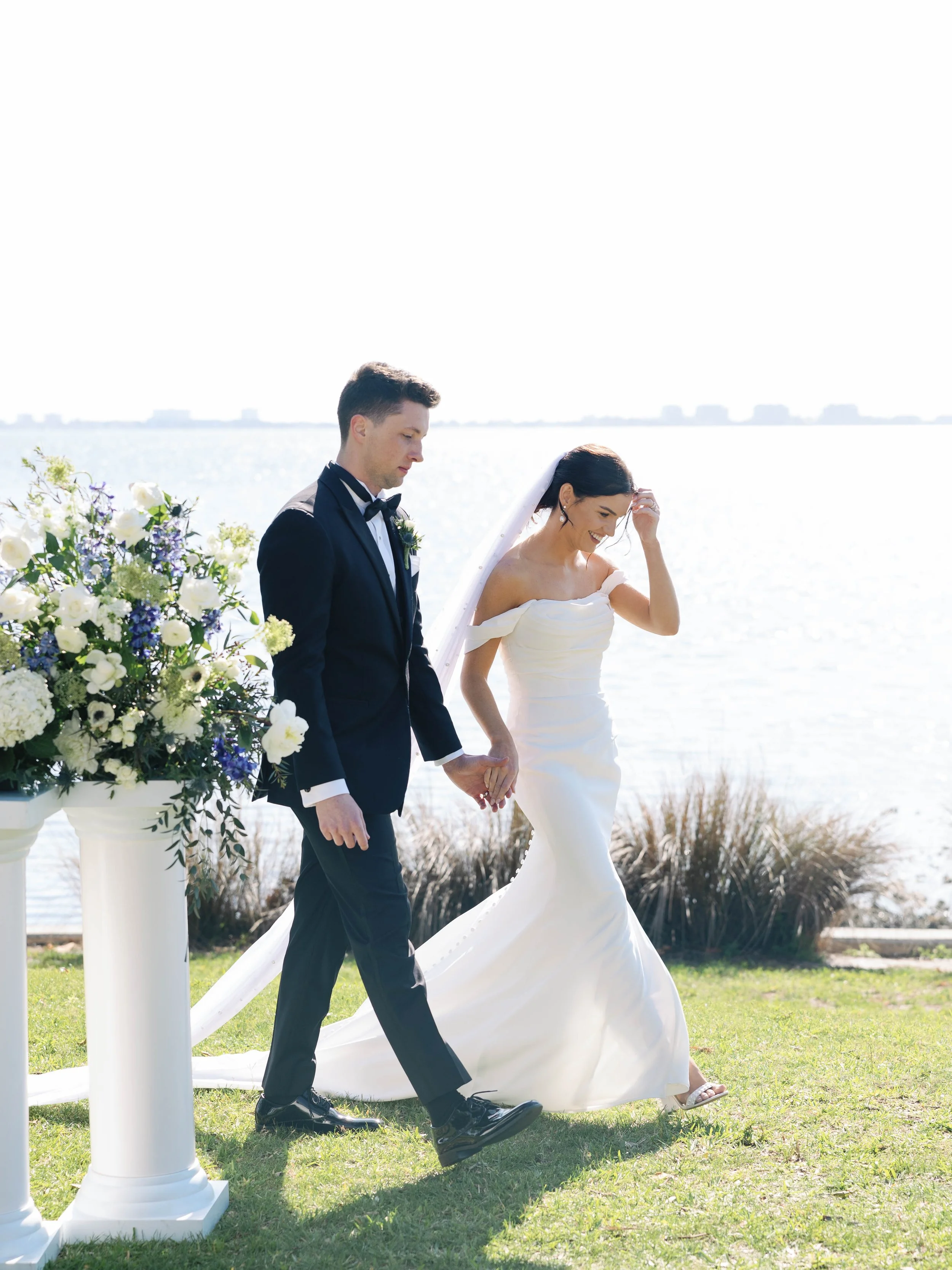 Bride and groom on their wedding day with flowers