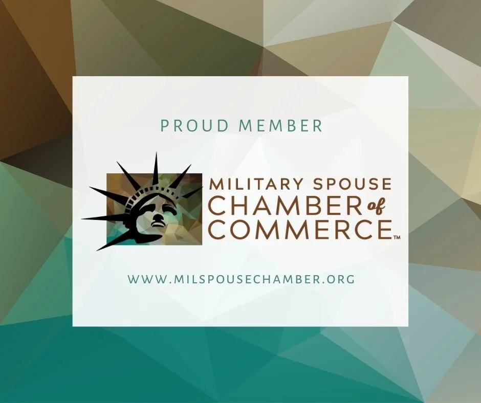 Logo of the Military Spouse Chamber of Commerce with a stylized Statue of Liberty head and the text 'Proud Member' and the website www.milspousechamber.org.