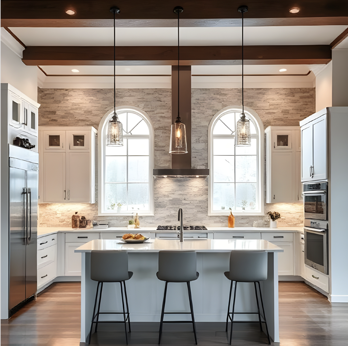 Castle Pines kitchen with white cabinetry, large island, and arched windows in luxury renovation.