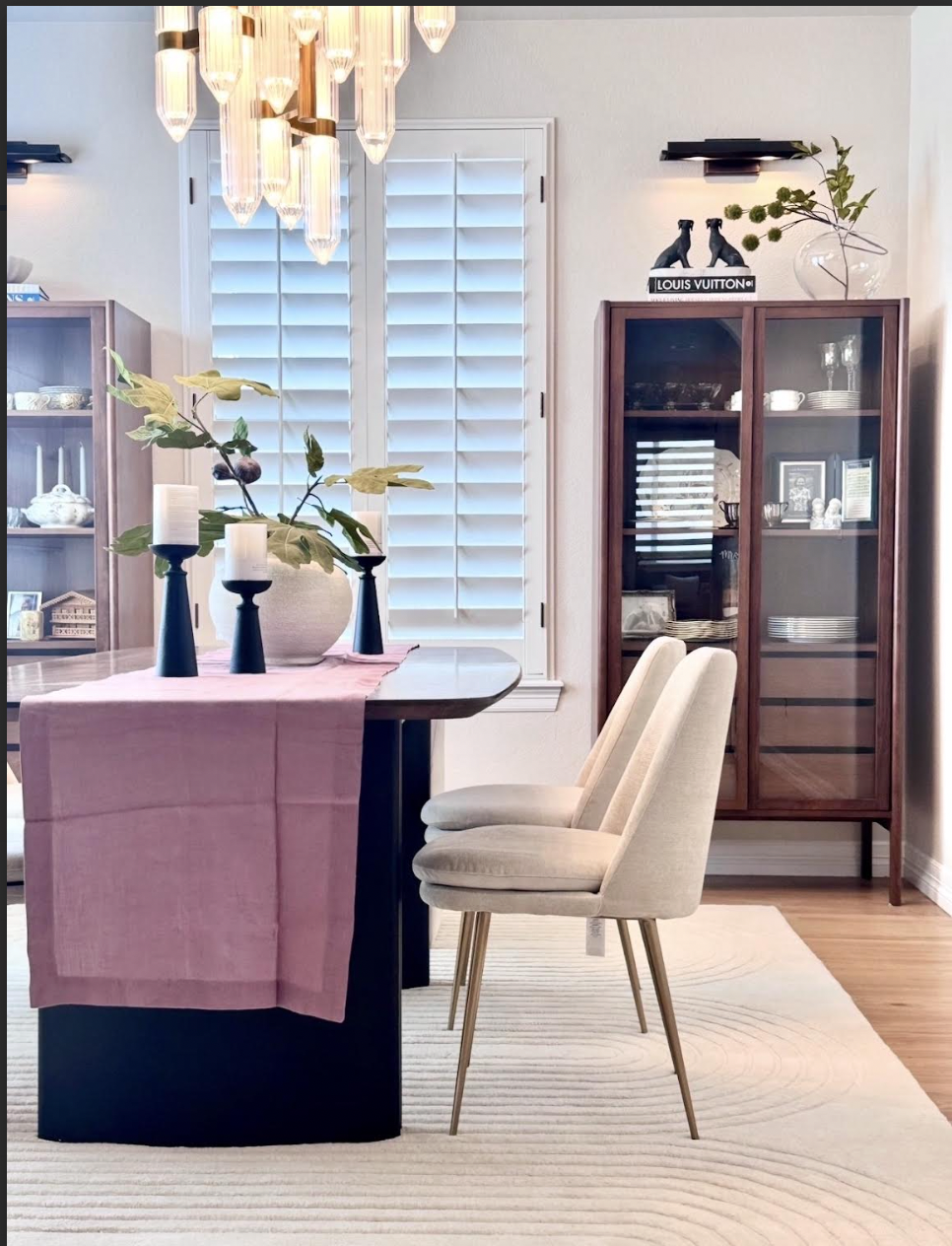Formal dining room in Castle Rock with crystal chandelier and custom millwork.