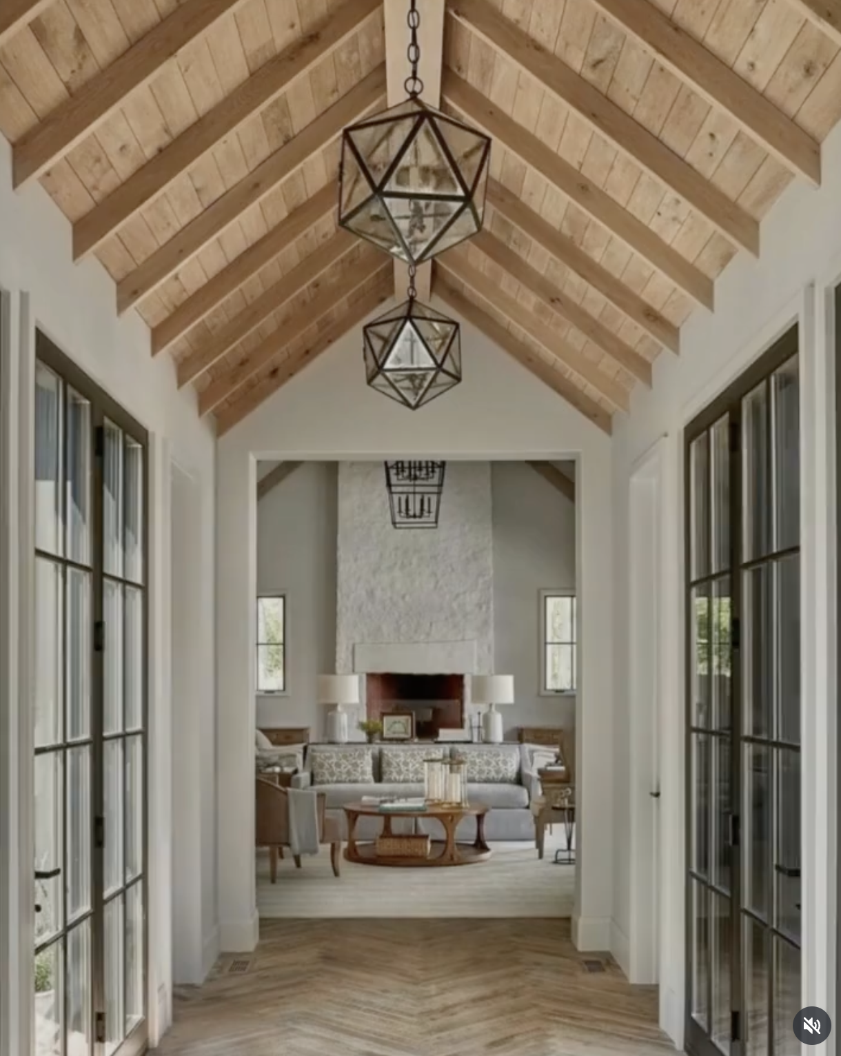 Castle Pines great room with vaulted wood ceiling, fireplace, and French doors in luxury whole-home renovation.