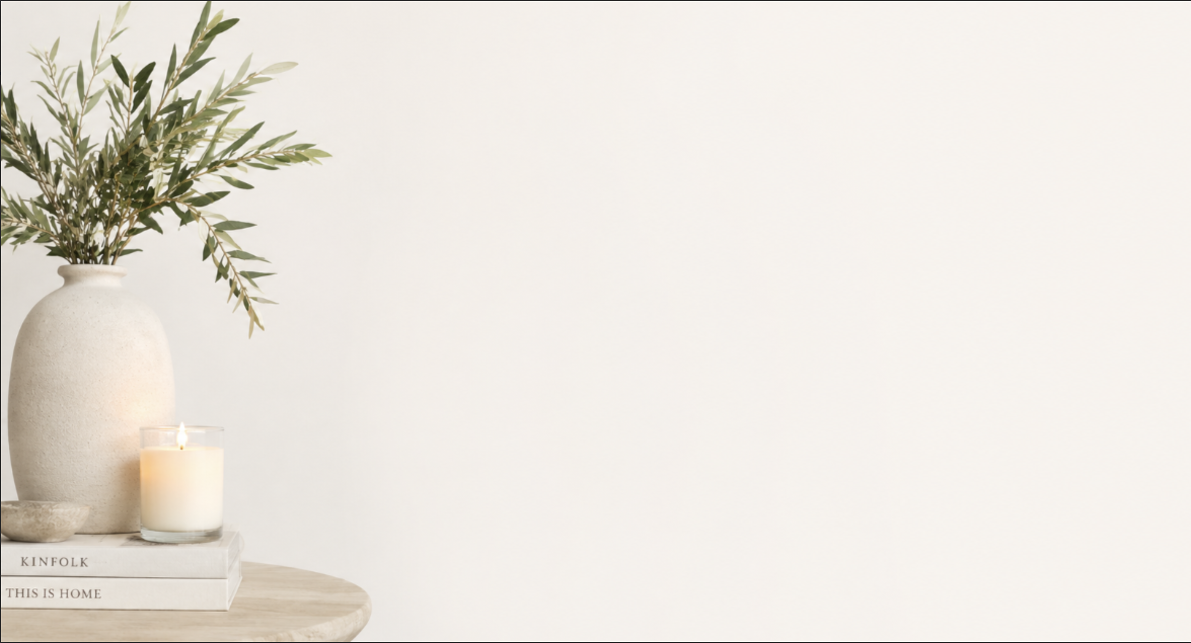 Styled vignette with vase, candles, and books, Indigo Day Designs