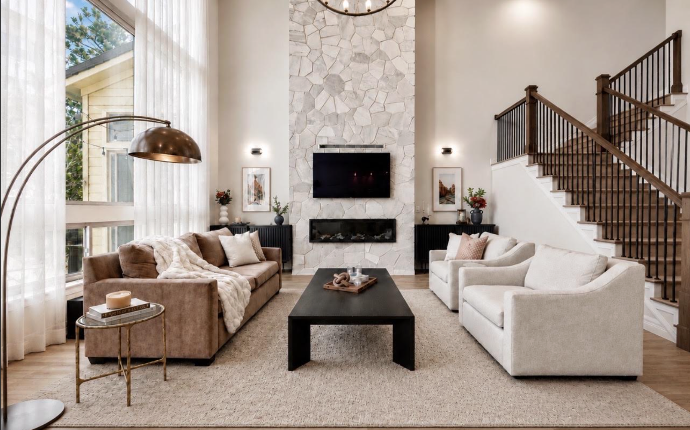 Modern living room with floor to ceiling stone fireplace in Lone Tree, Colorado.