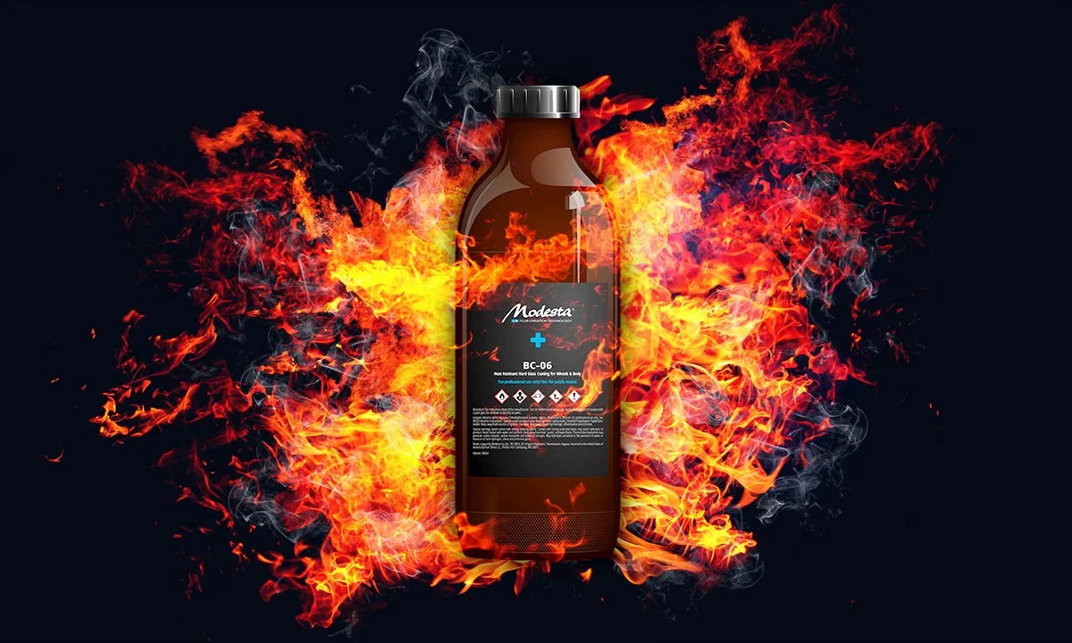 A brown bottle labeled Modesta BC-06 placed in front of a fiery explosion with flames and smoke on a dark background.