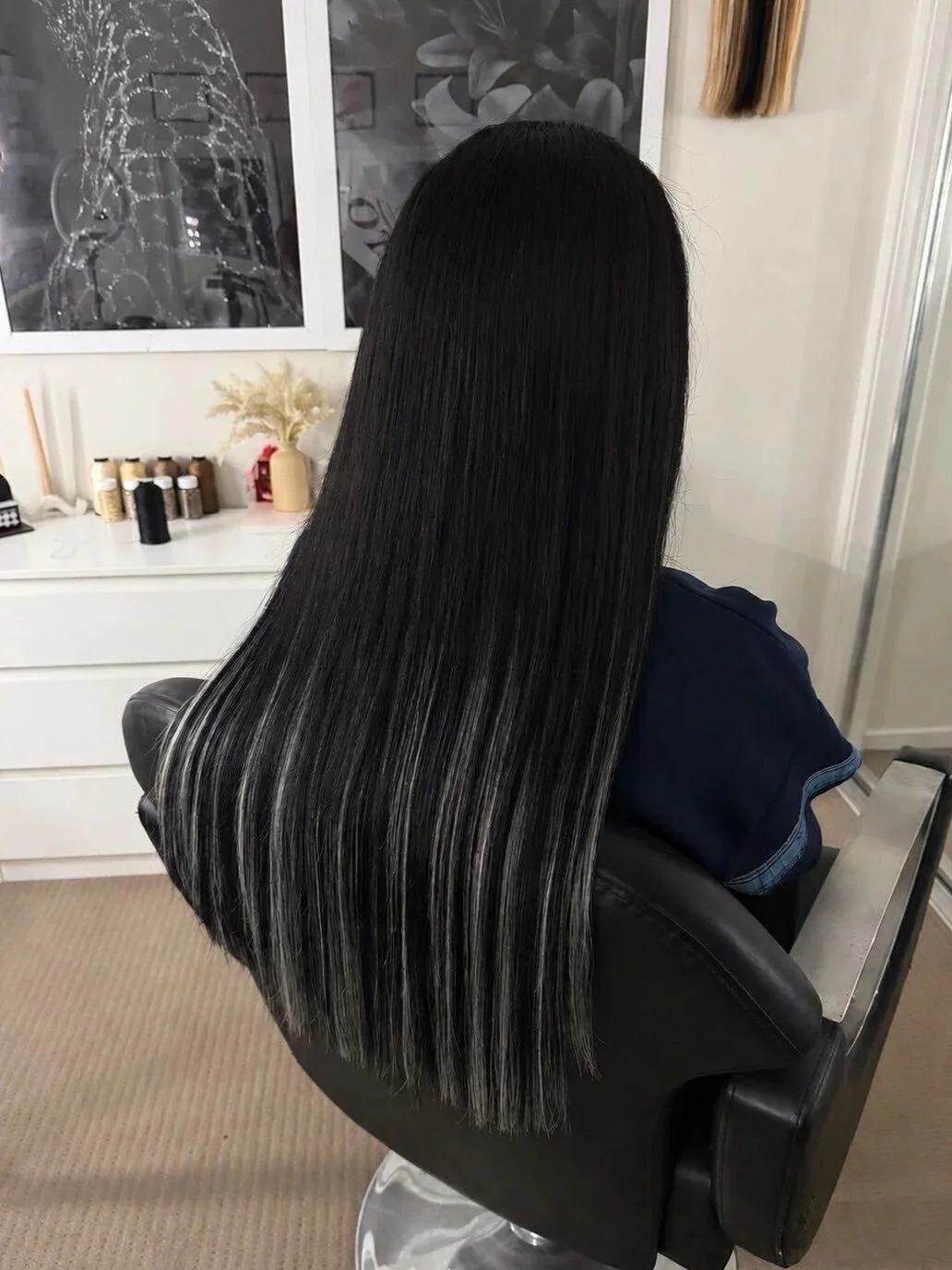 Long, straight black 26" premium double-drawn hair extensions, seamlessly blended for a flawless, naturally elevated finish.
