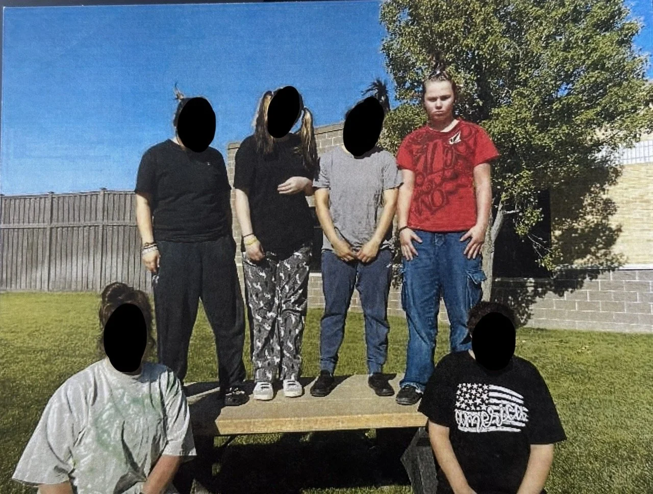 Rubies unit taking group photo in courtyard