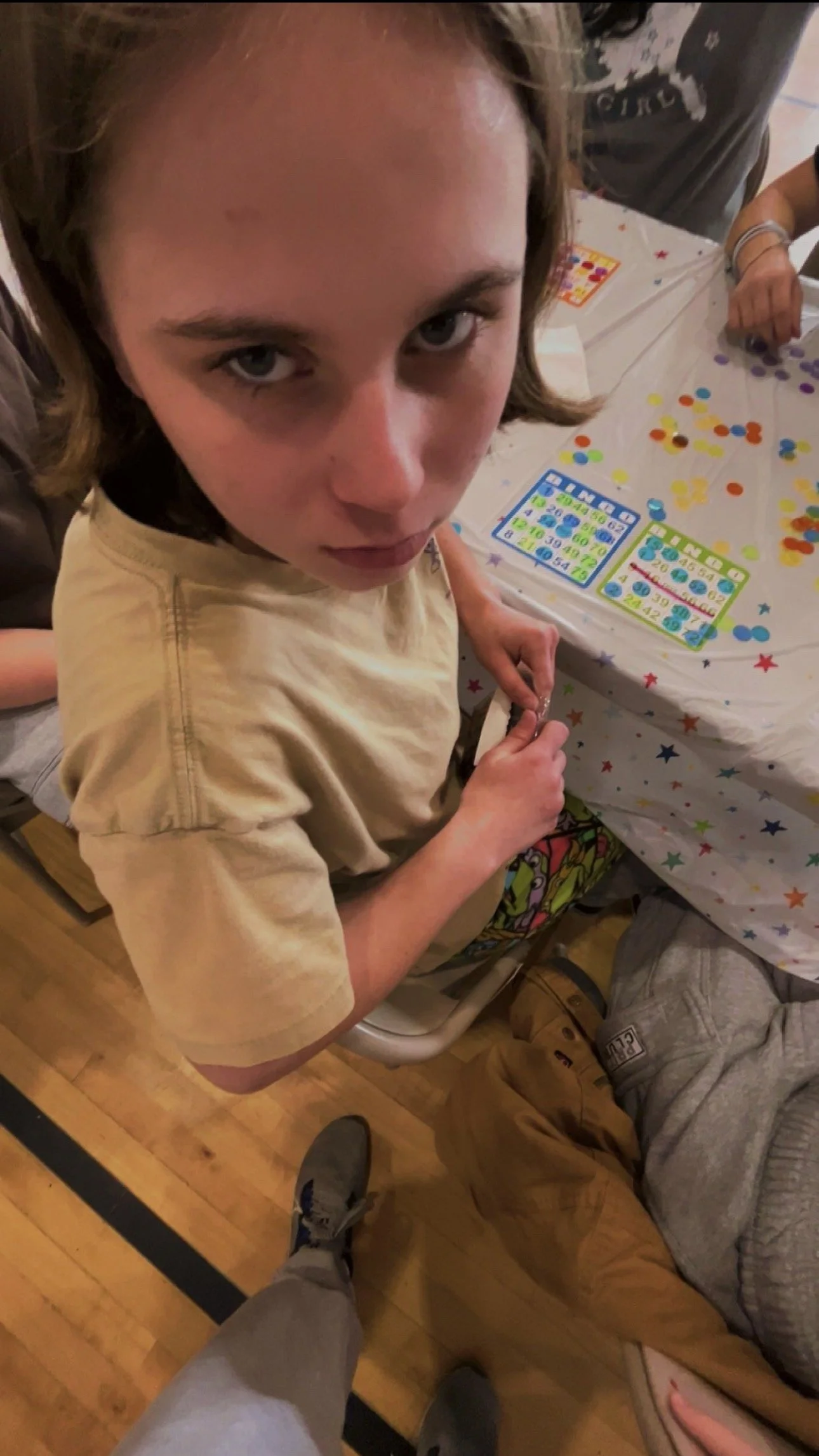 Julia Castellano playing bingo for sugary snacks at an event