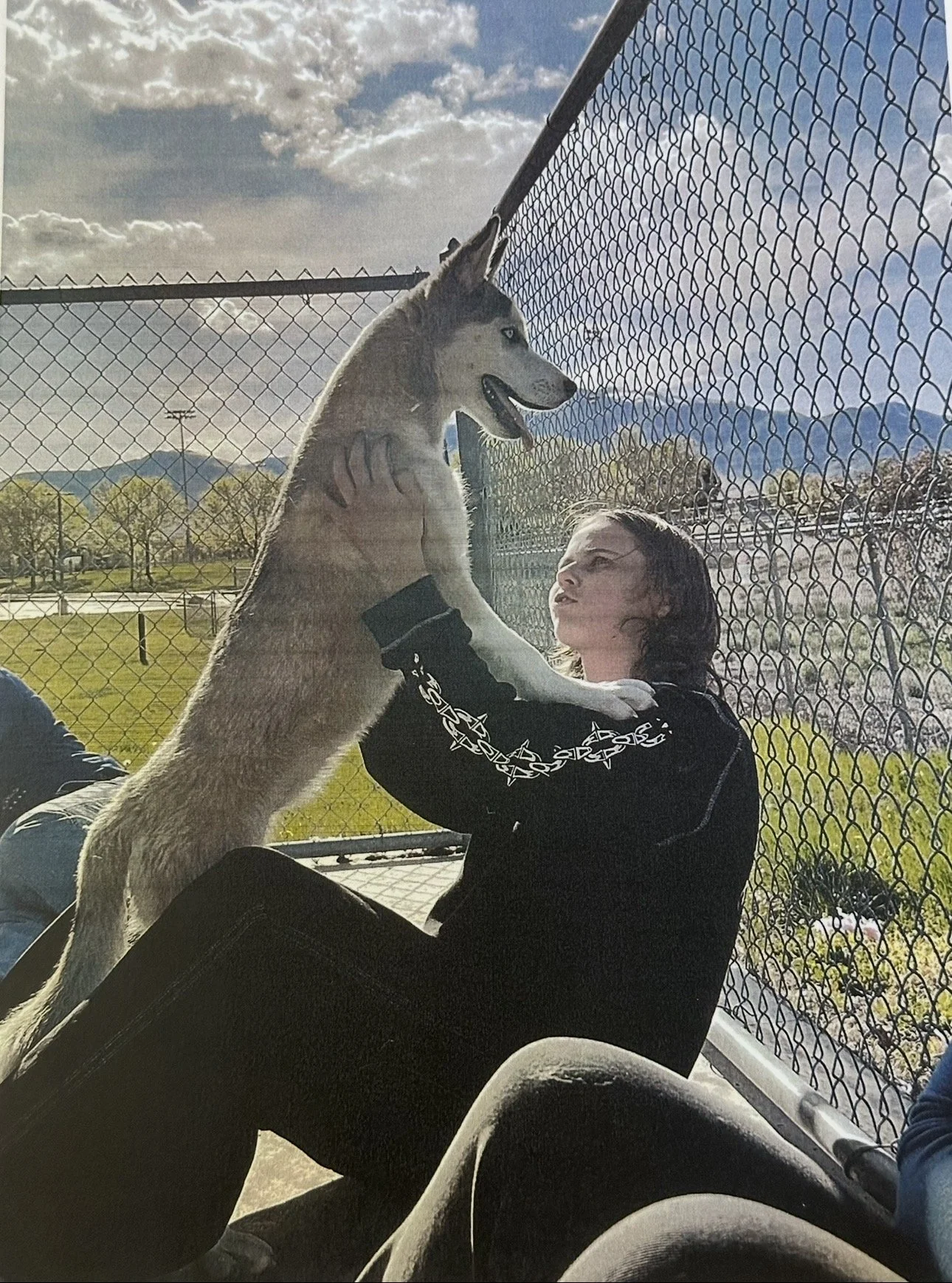 Julia Castellano holding a puppy during an outing