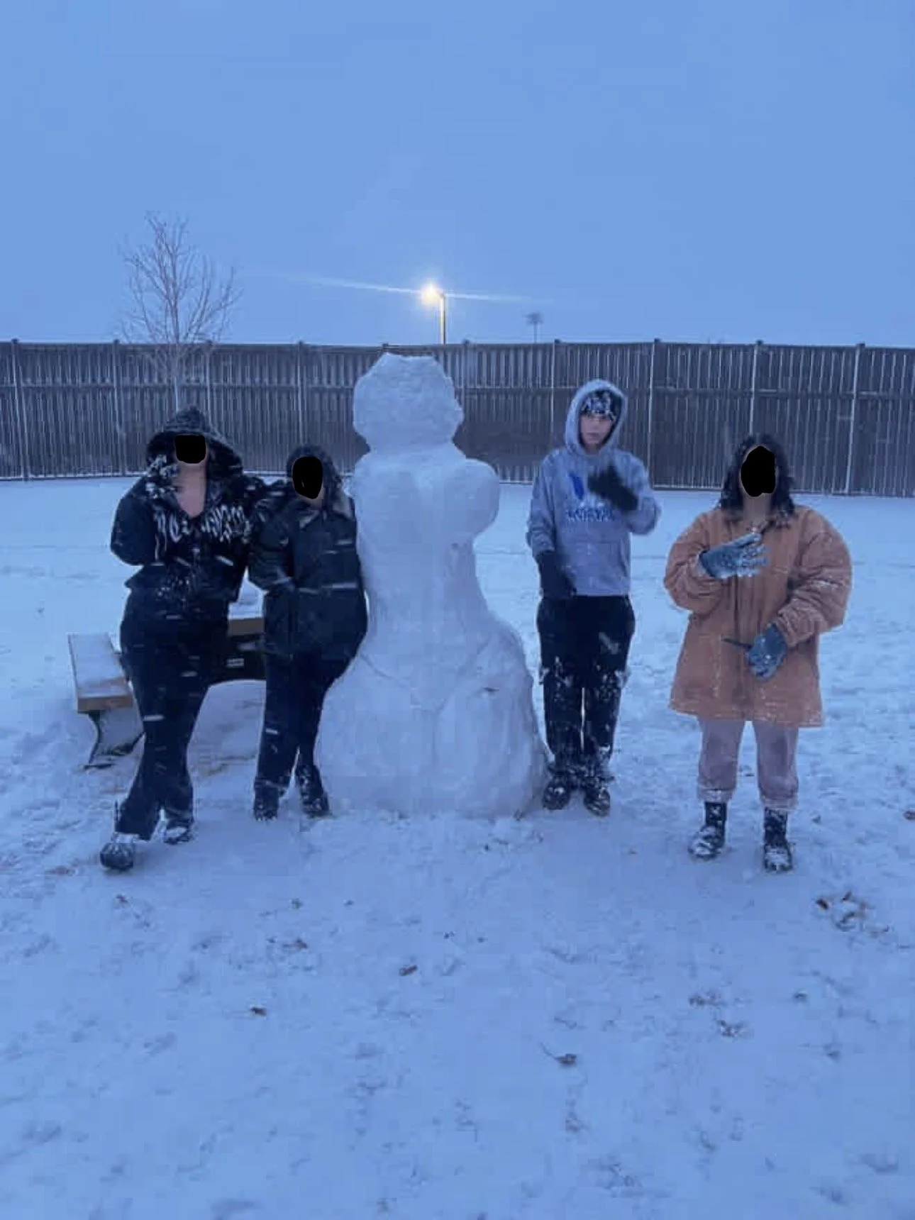 Julia Castellano with snowman in a lockdown facility