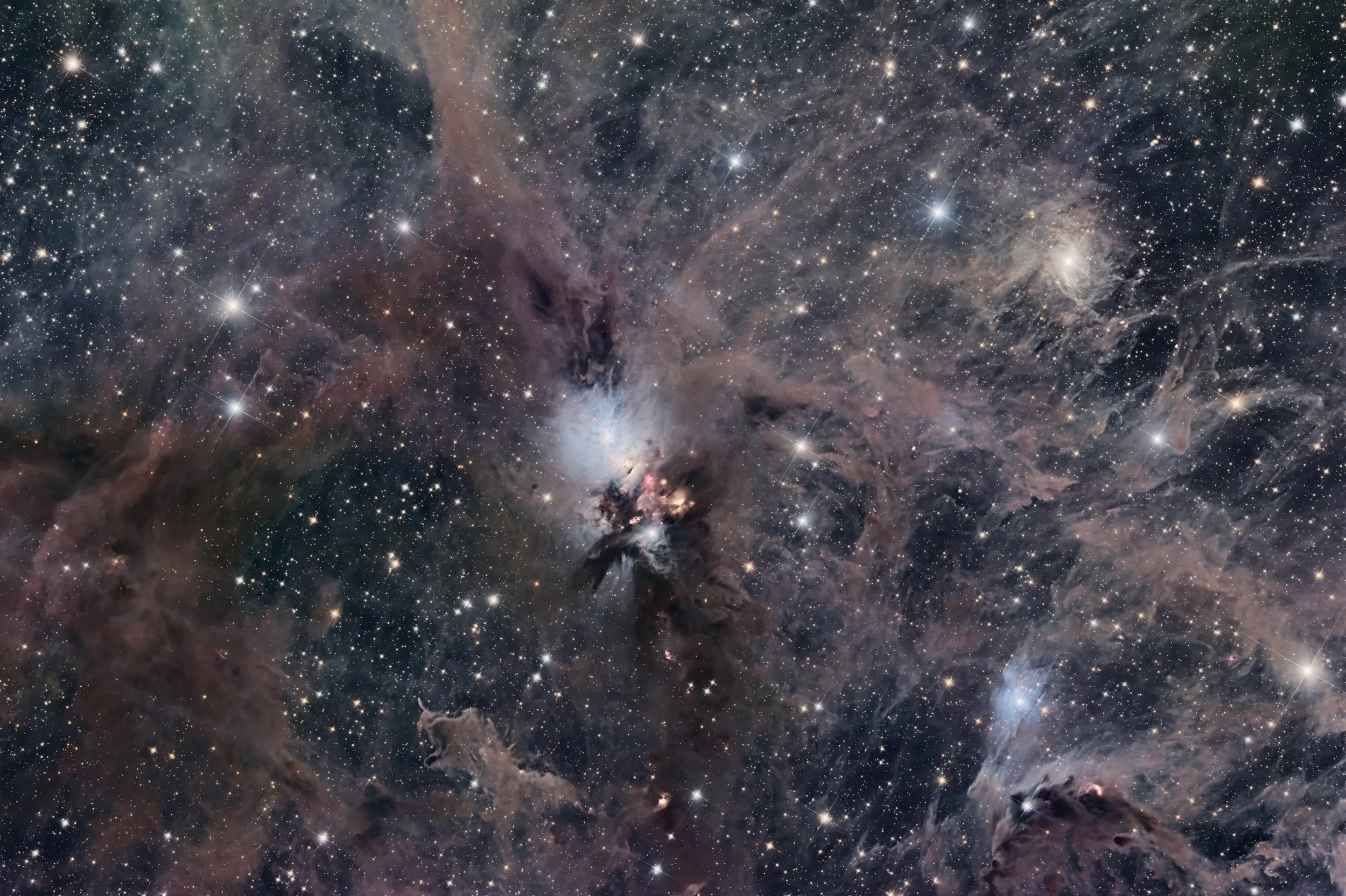 A detailed image of a vast galaxy filled with numerous bright stars, nebulae, and cosmic dust.