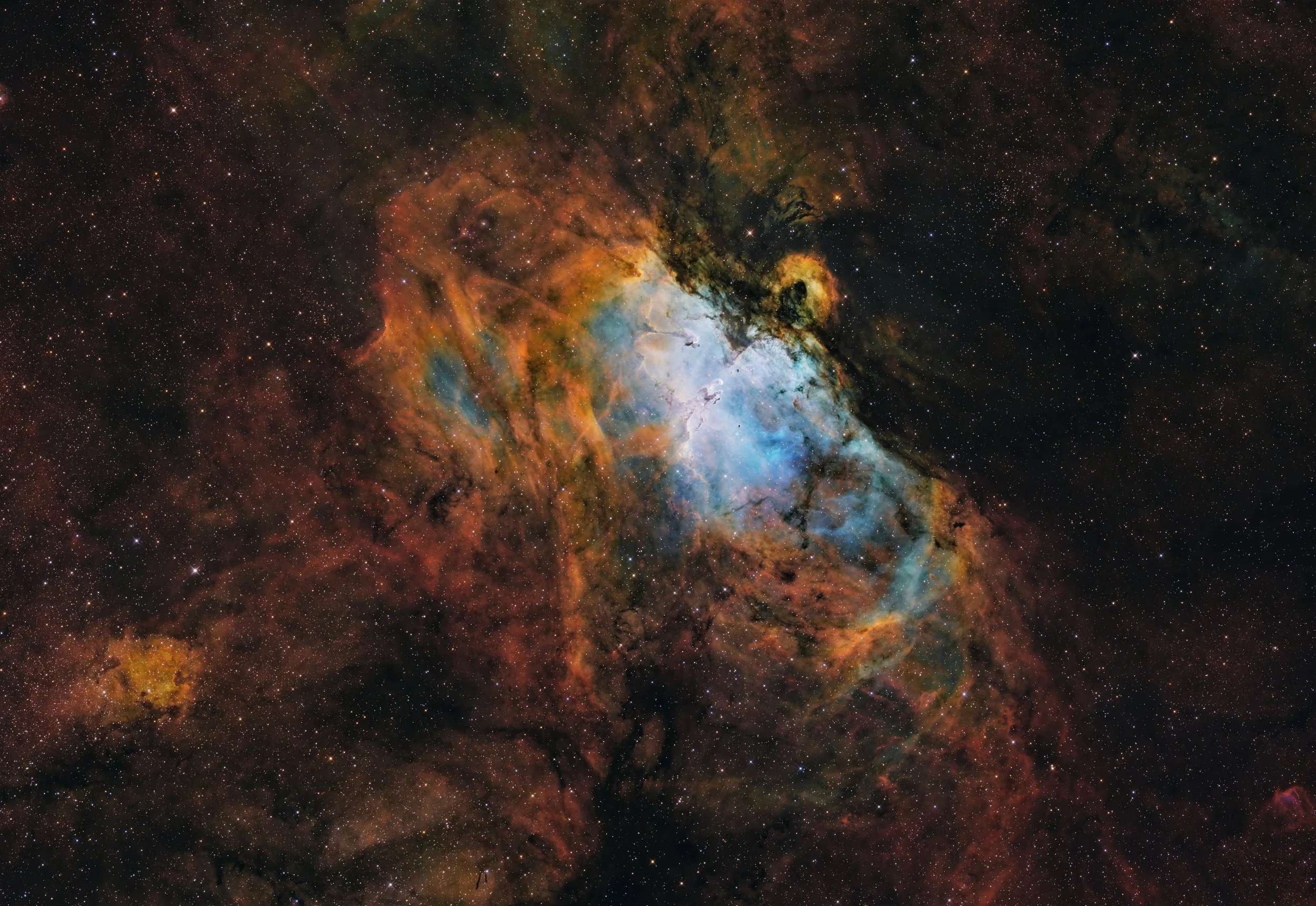 A colorful and detailed image of a nebula in space with stars scattered throughout.
