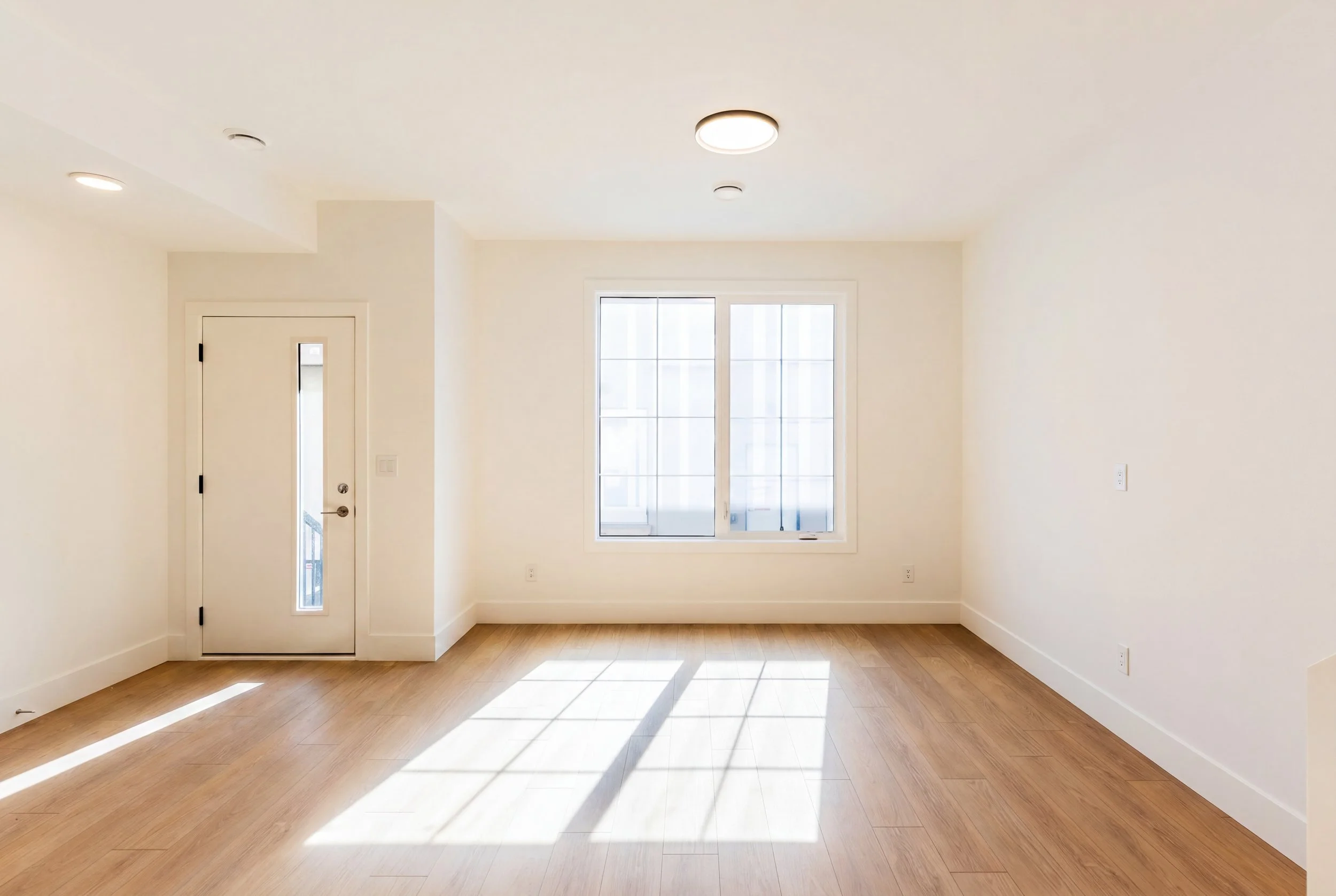 Unit 203 Uptown 17th Calgary 3-bed townhouse bright entryway with private entrance and open layout - available at Suite Getaways
