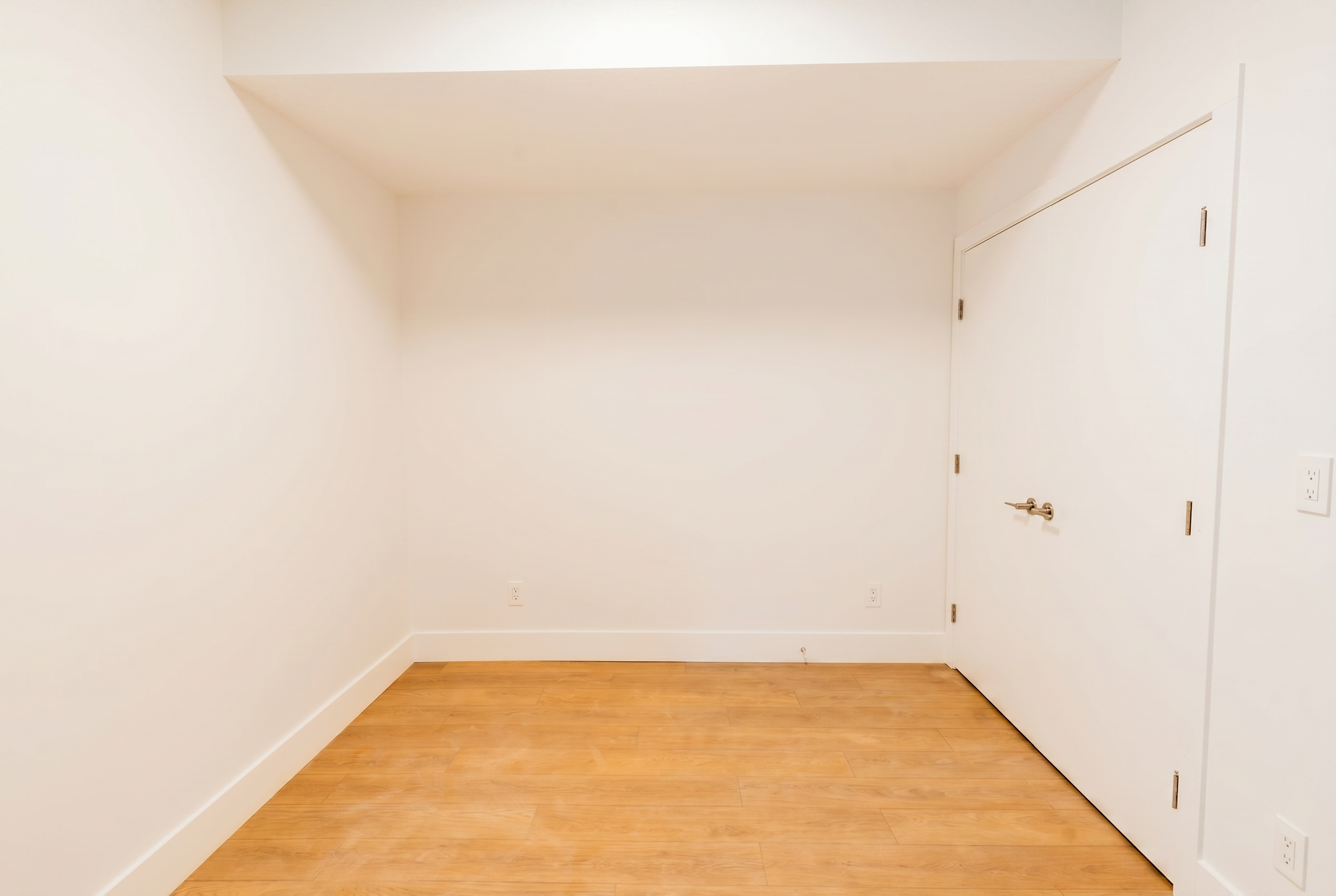 Closet and storage space with LVP flooring in Unit 103R Uptown 17th Calgary 1-bedroom lower suite rental near 17th Ave SW by Suite Getaways