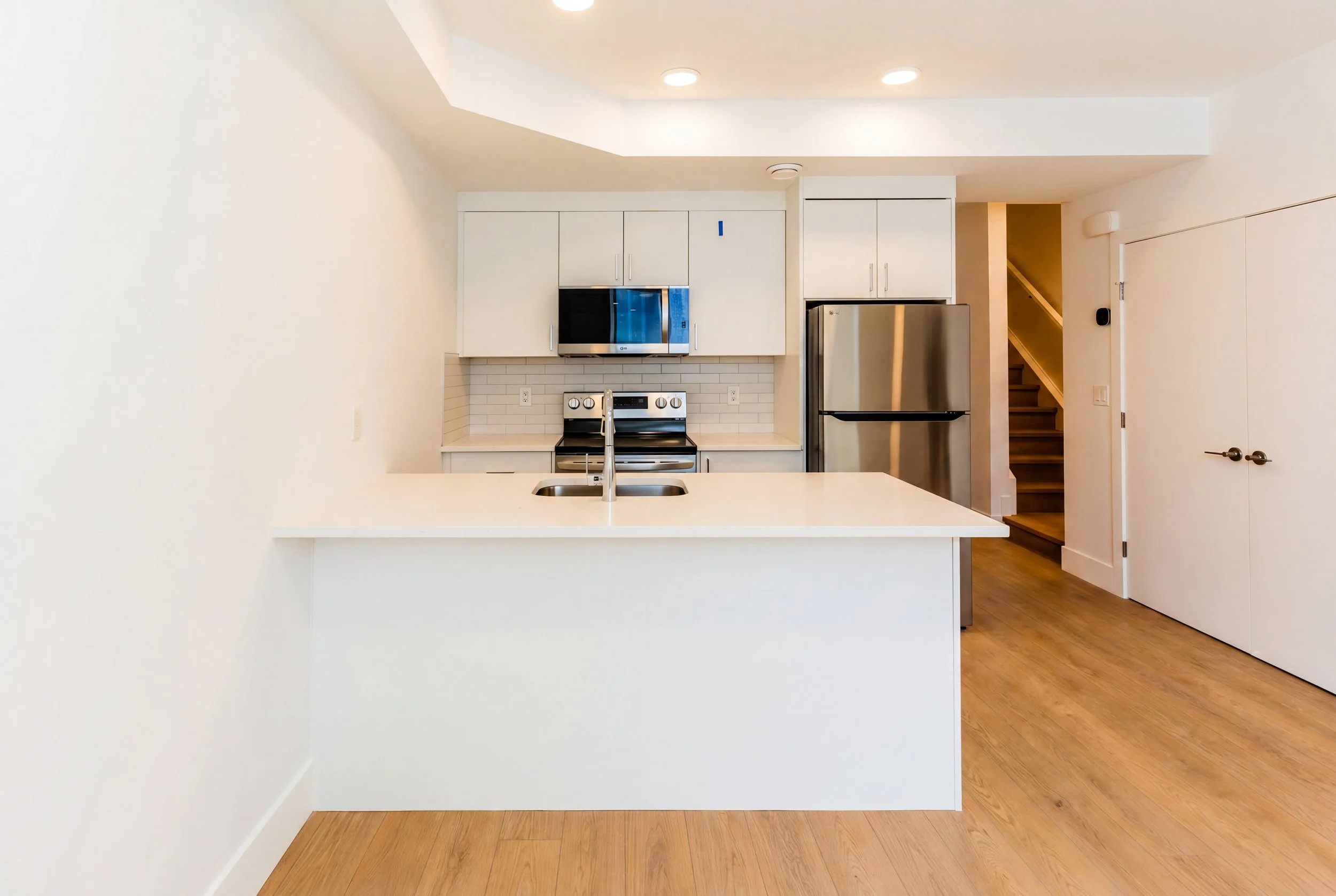 Full kitchen and lower suite view in Unit 204R Uptown 17th Calgary 1-bedroom lower suite rental near 17th Ave SW by Suite Getaways