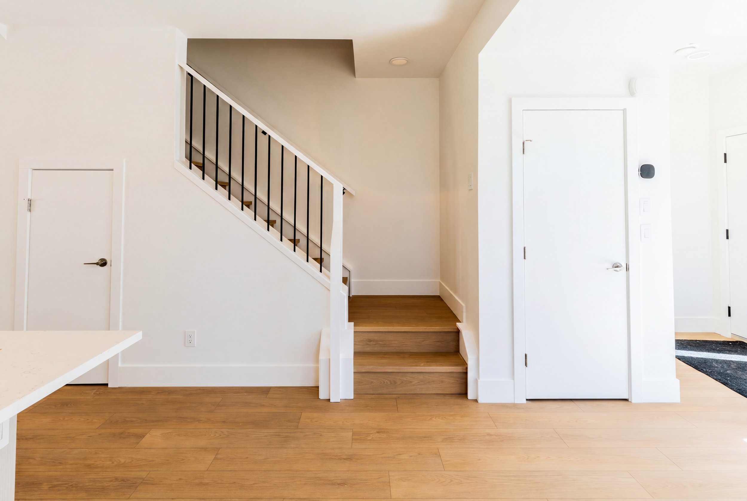 Unit 204 Uptown 17th Calgary 3-bed townhouse open staircase and private entrance foyer - available at Suite Getaways