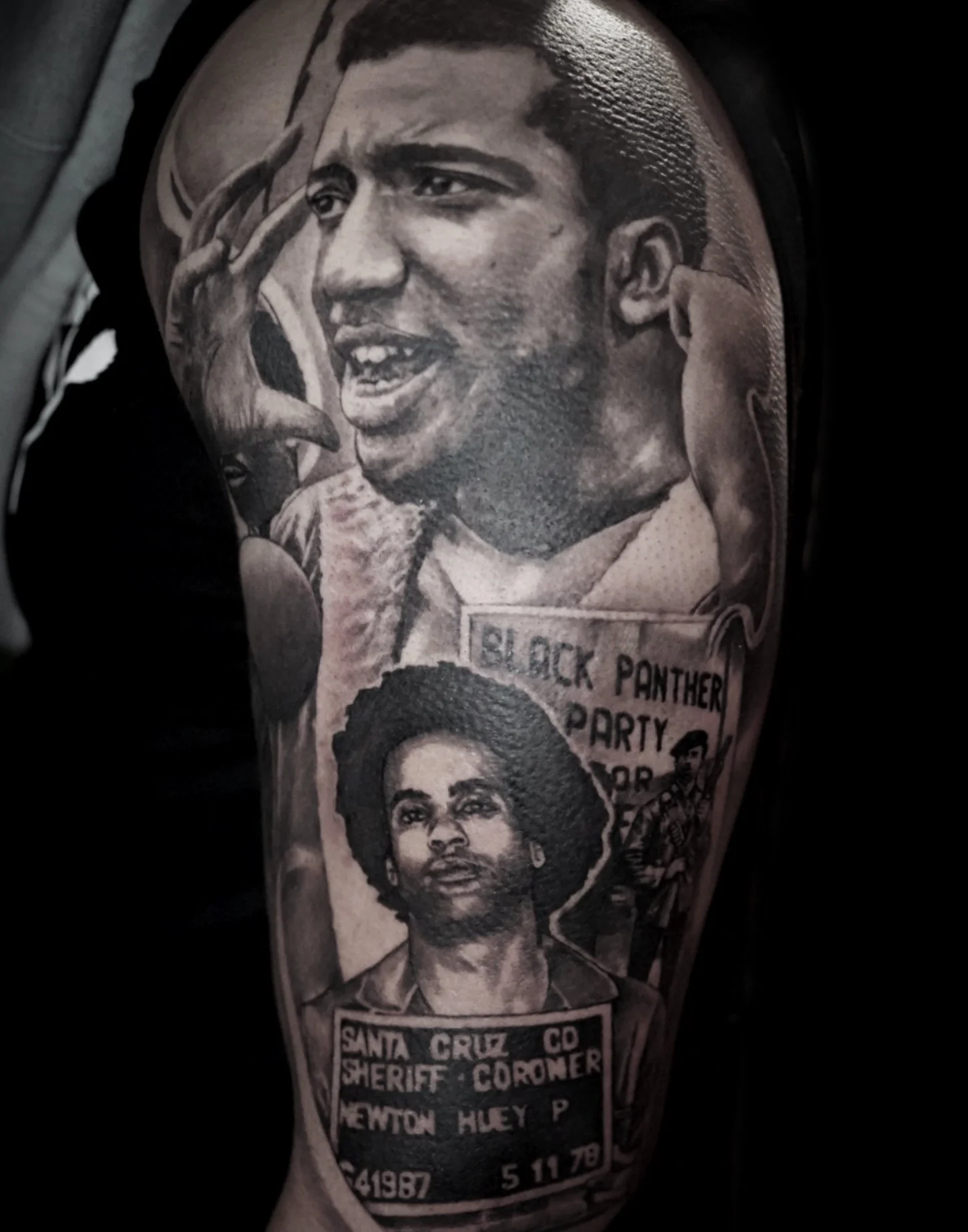 Tattoo depicting a woman with an afro hairstyle, with text referencing Santa Cruz County Sheriff's Co. and Newtown huey P.