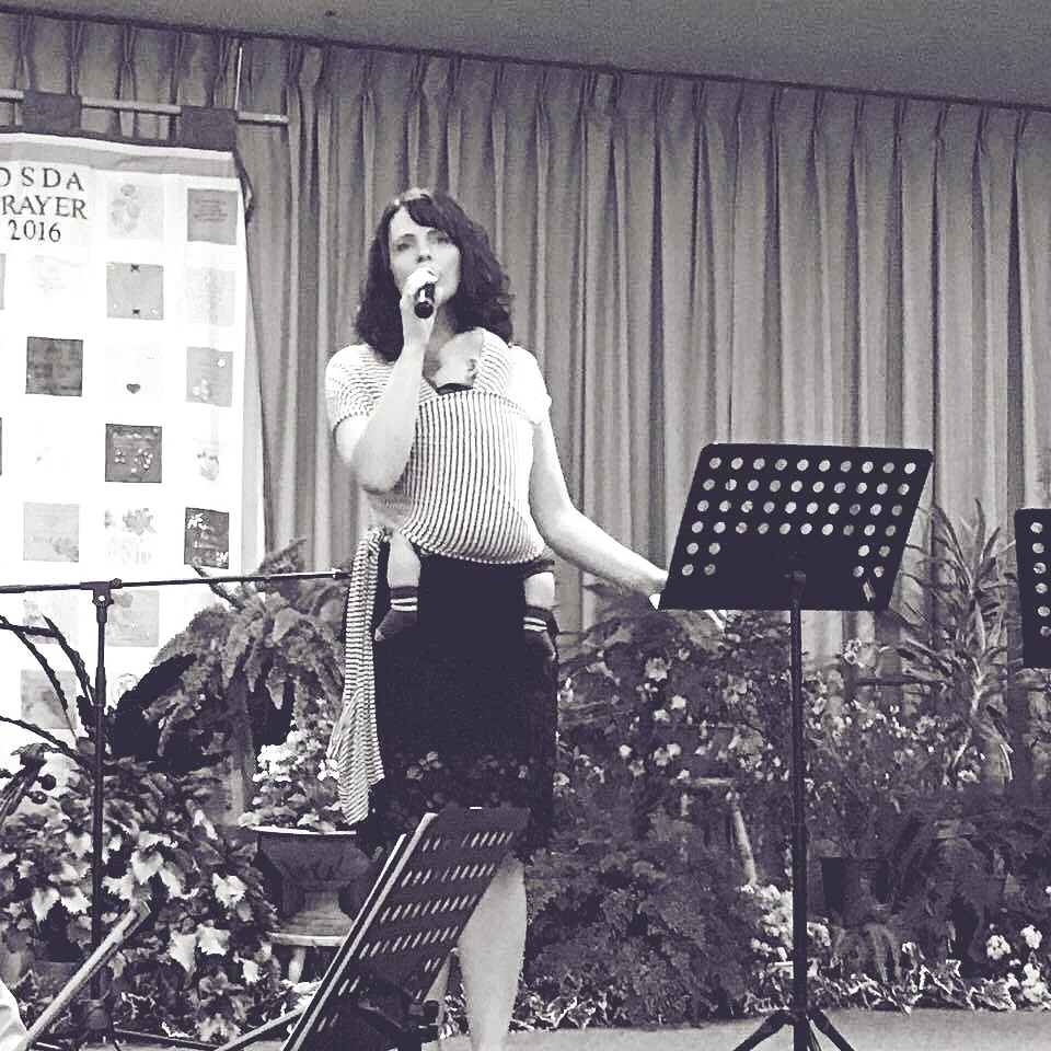 Ezra fast asleep while Monique sings up in Maitland SDA Church, NSW Australia.