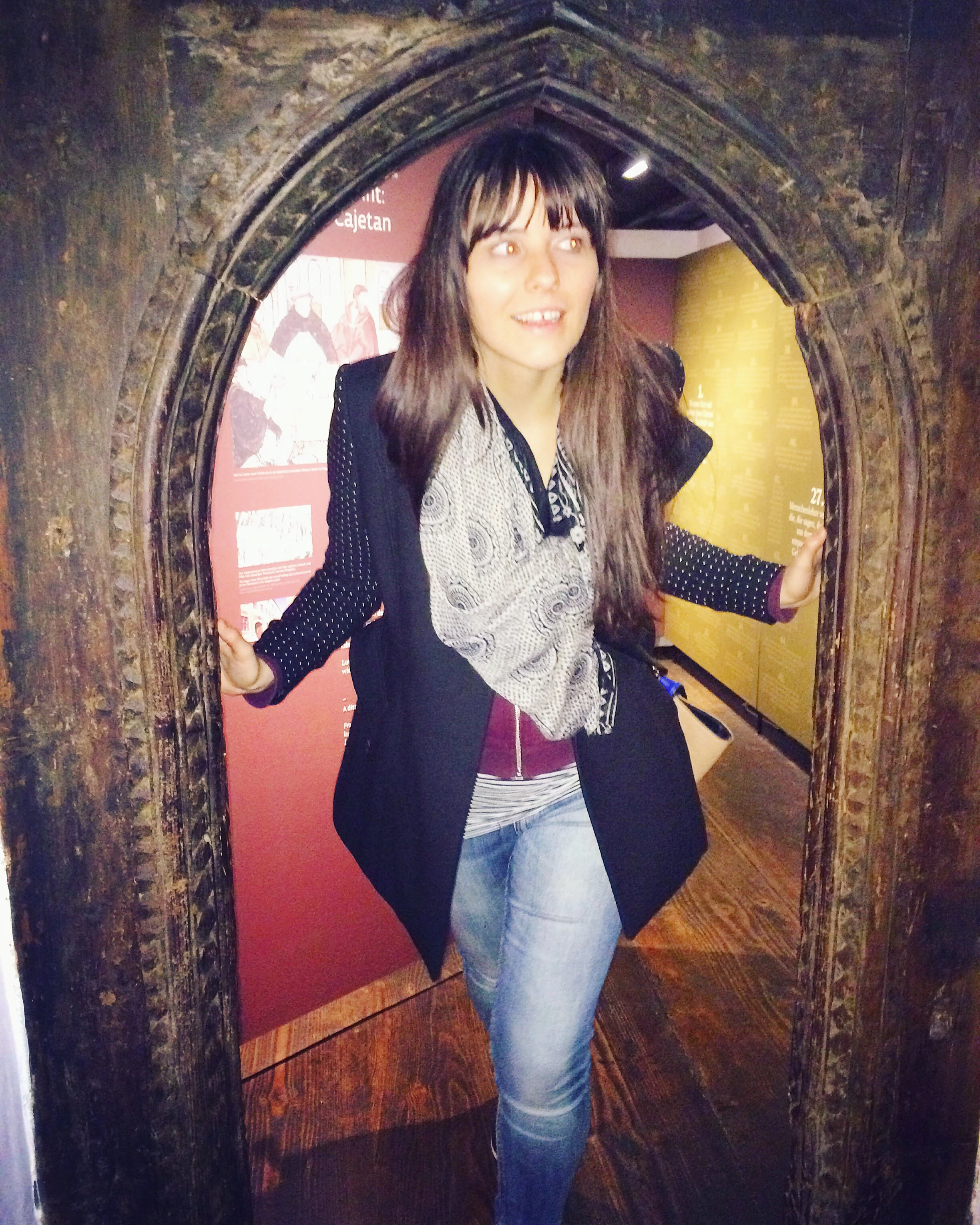 Monique facinated by the Martin Luther exhibits in St Anna, Augsburg.