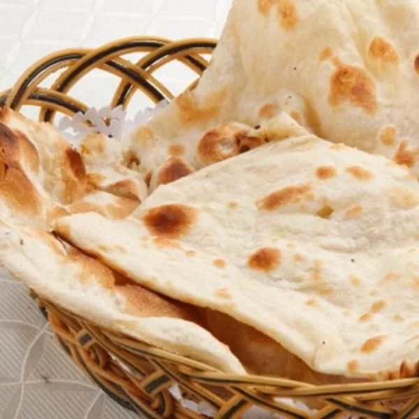 A basket filled with naan bread.
