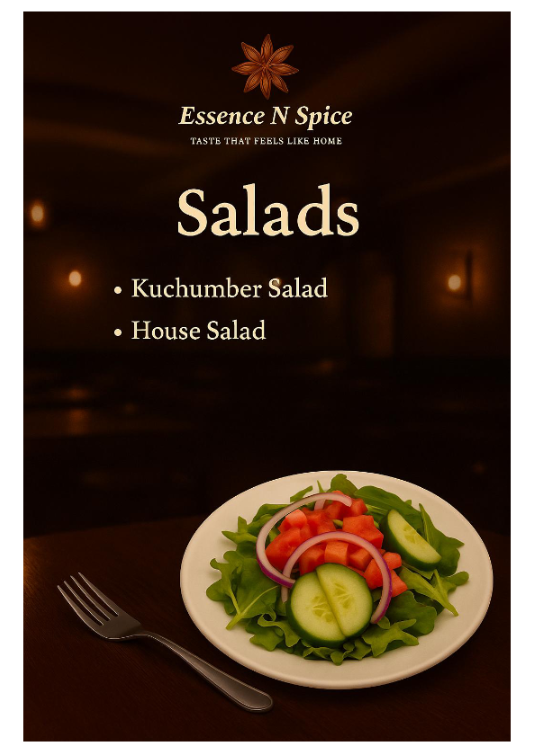 A plate of fresh salad with lettuce, cucumber, tomato, and onion slices, on a dark wooden table, with a fork beside it. In the background, there is a menu that reads 'Essence N Spice', offering cucumber and house salads.