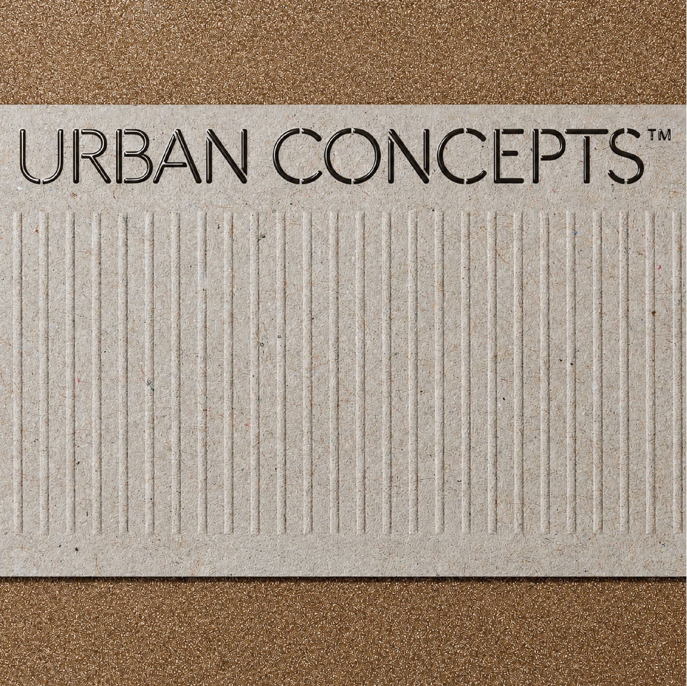 Close-up of a textured paper surface with the words 'URBAN CONCEPTS' embossed in black on a beige background, with a brown textured surface surrounding the paper.
