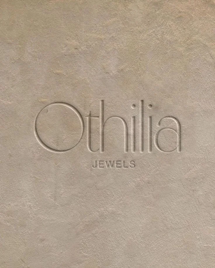 Text embossed on a beige surface reads 'Othilia Jewels'.