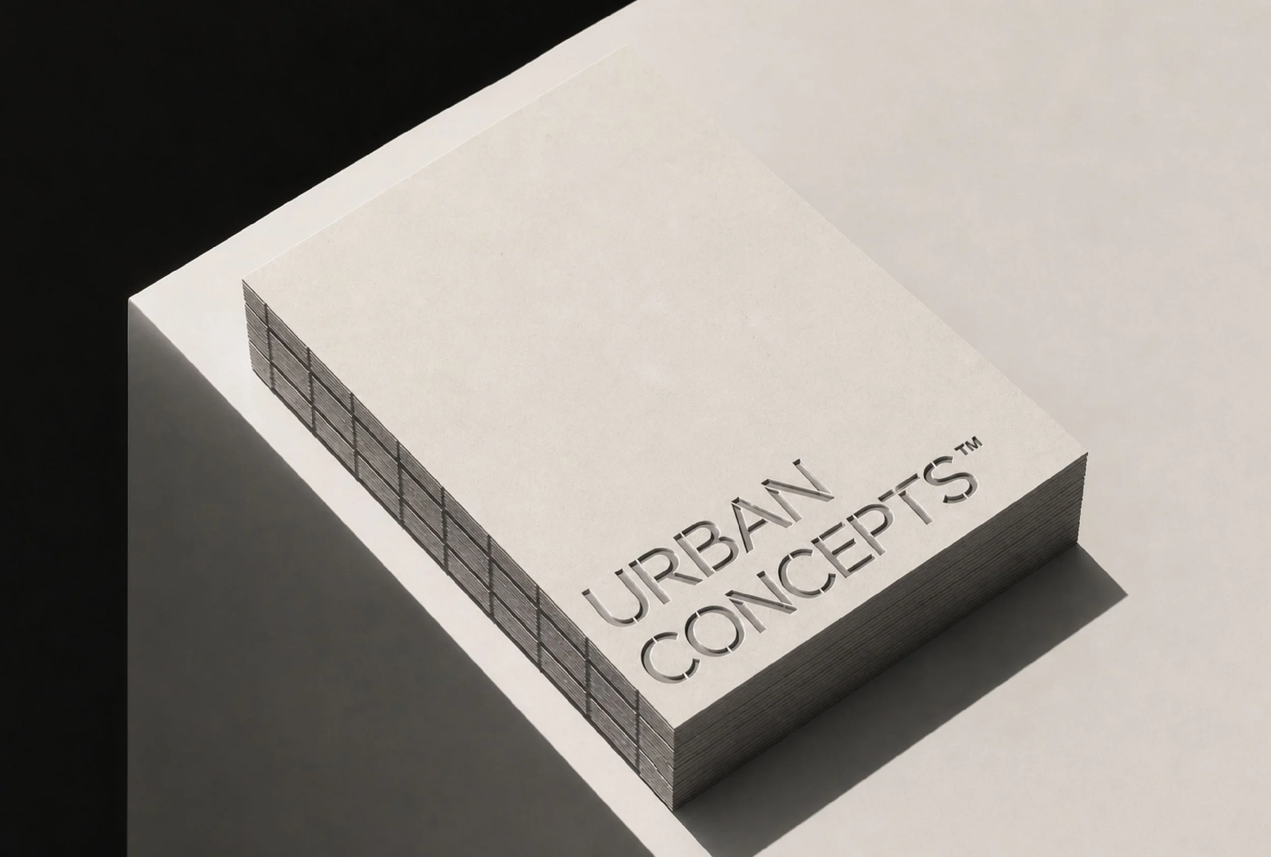 Close-up of a stack of white index cards with partially visible text that reads 'URBAN UPDATES . . . ' on a dark background.