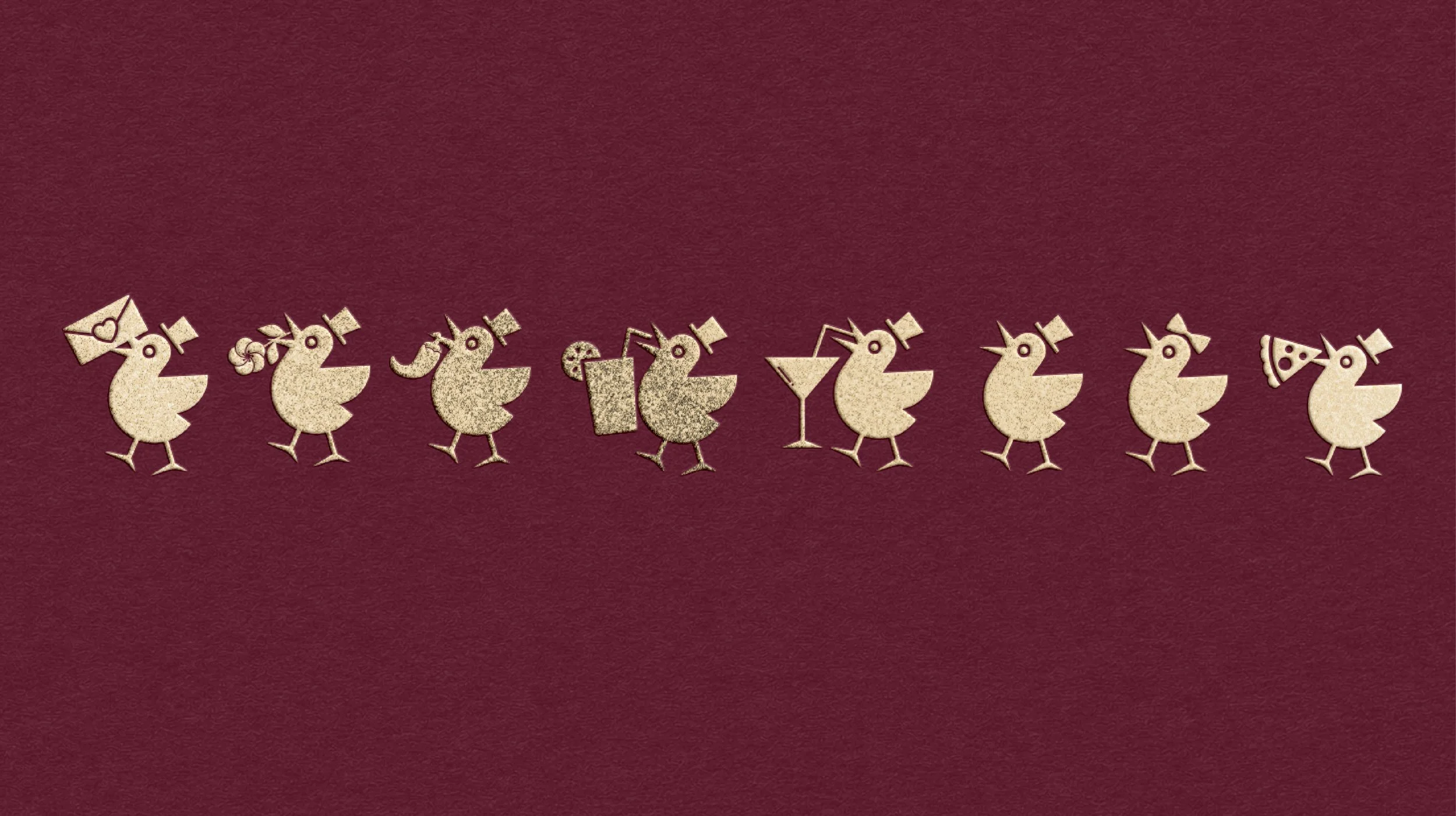 Gold-colored decorative paper chicks wearing party hats, holding drinks and a pizza slice, arranged in a line on a maroon background.