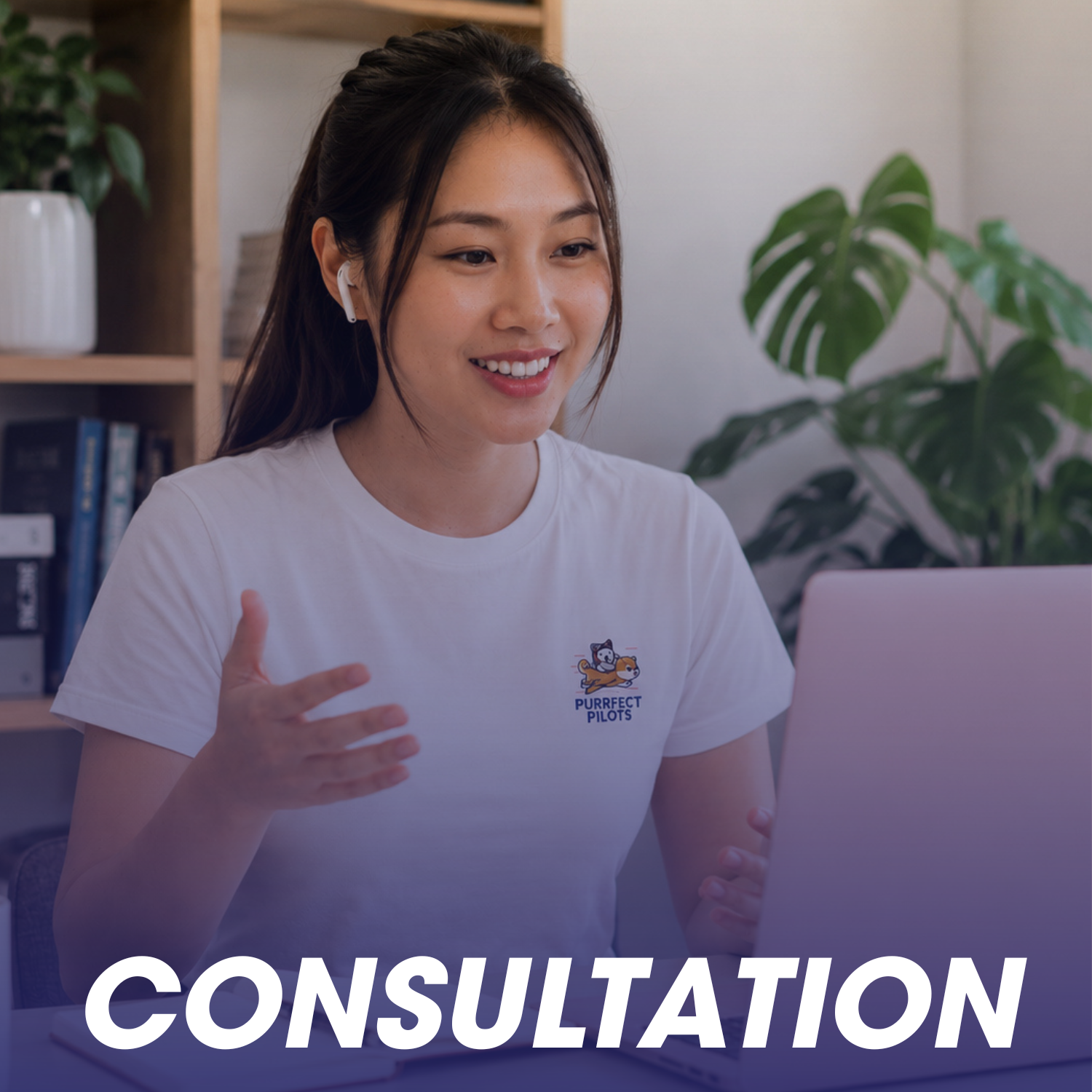 A woman wearing a white t-shirt with a 'Purrfect Pilots' logo, sitting at a desk and having a video consultation on a laptop, with a large houseplant and bookshelf in the background.