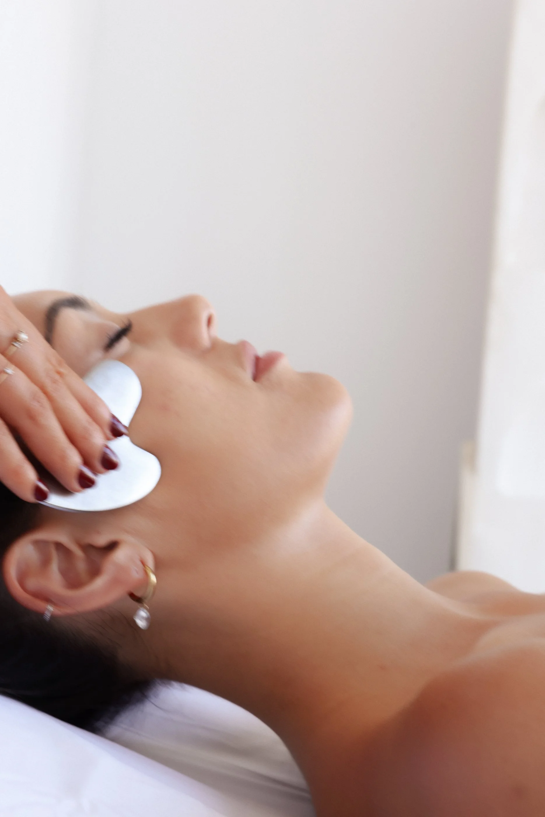 Client receiving facial treatment or skin mask at Gold Coast dermal therapy clinic Mermaid Beach acne and skin specialist Queensland