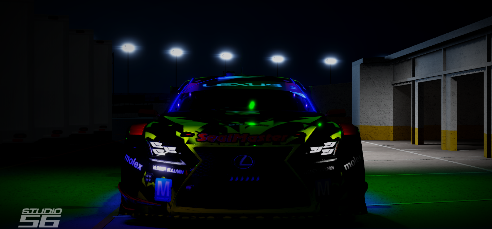 A race car under stadium lights at night with glowing neon accents, sponsor logos, and a sleek black body.
