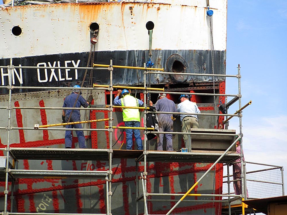 Final-hul-plate-lifted-and-almost-in-position.jpg
