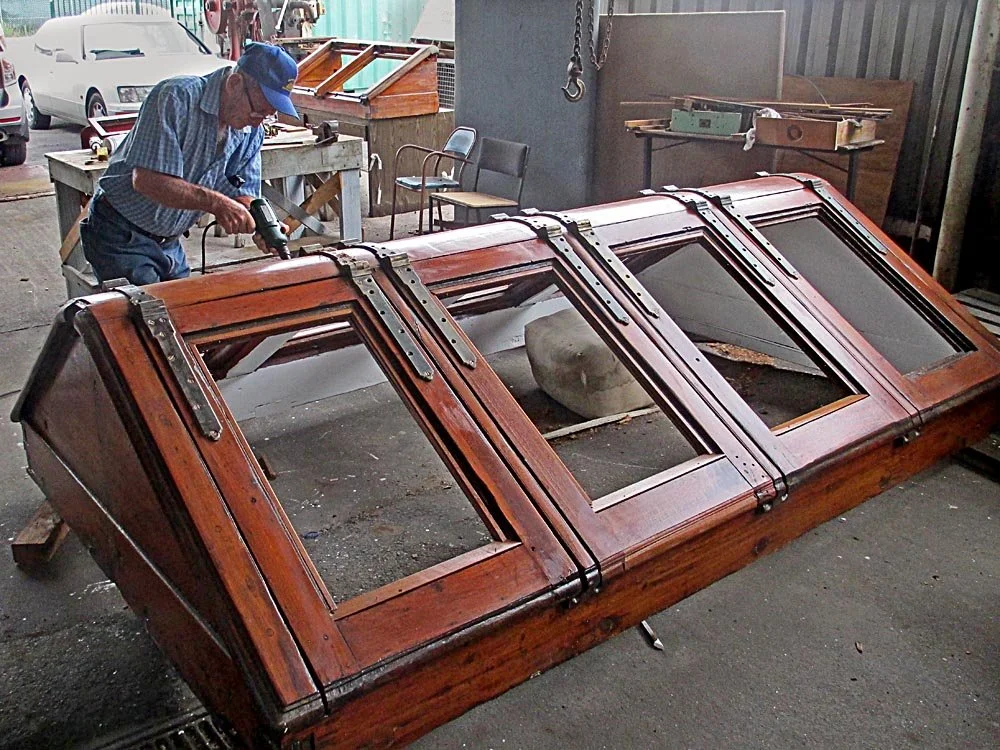 George-reattaching-bronze-hinges-John-Oxley-engine-room-skylights-in-teak.jpg