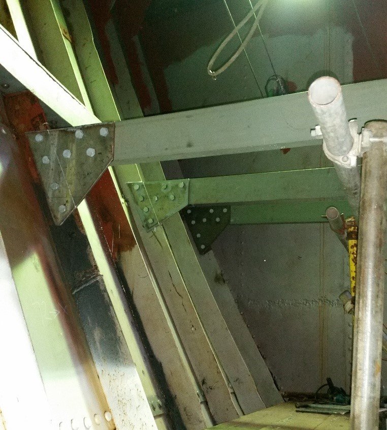 Newbuild forward hold work platform beams bolted to original frames stbd side