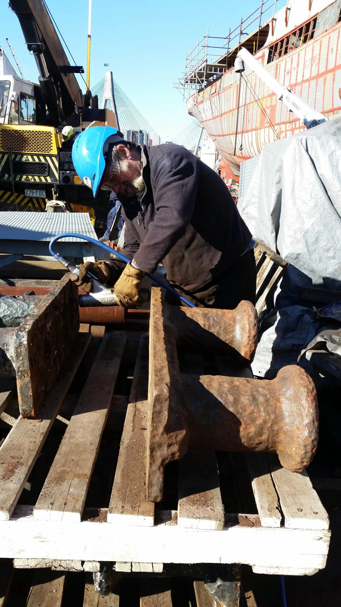 Dave needle gunning well deck mooring bitts