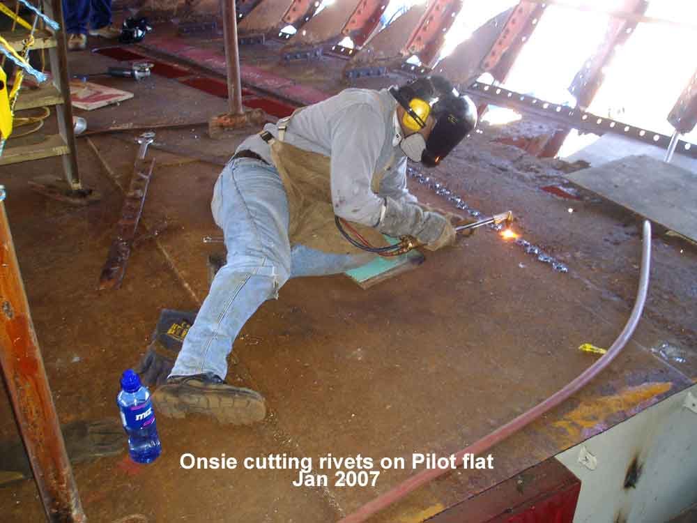 JO-Onsie-cutting-rivets-pilot-flat-2007.jpg