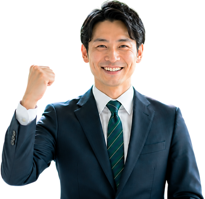 スーツを着た男性が喜びの表情で拳を握りしめている