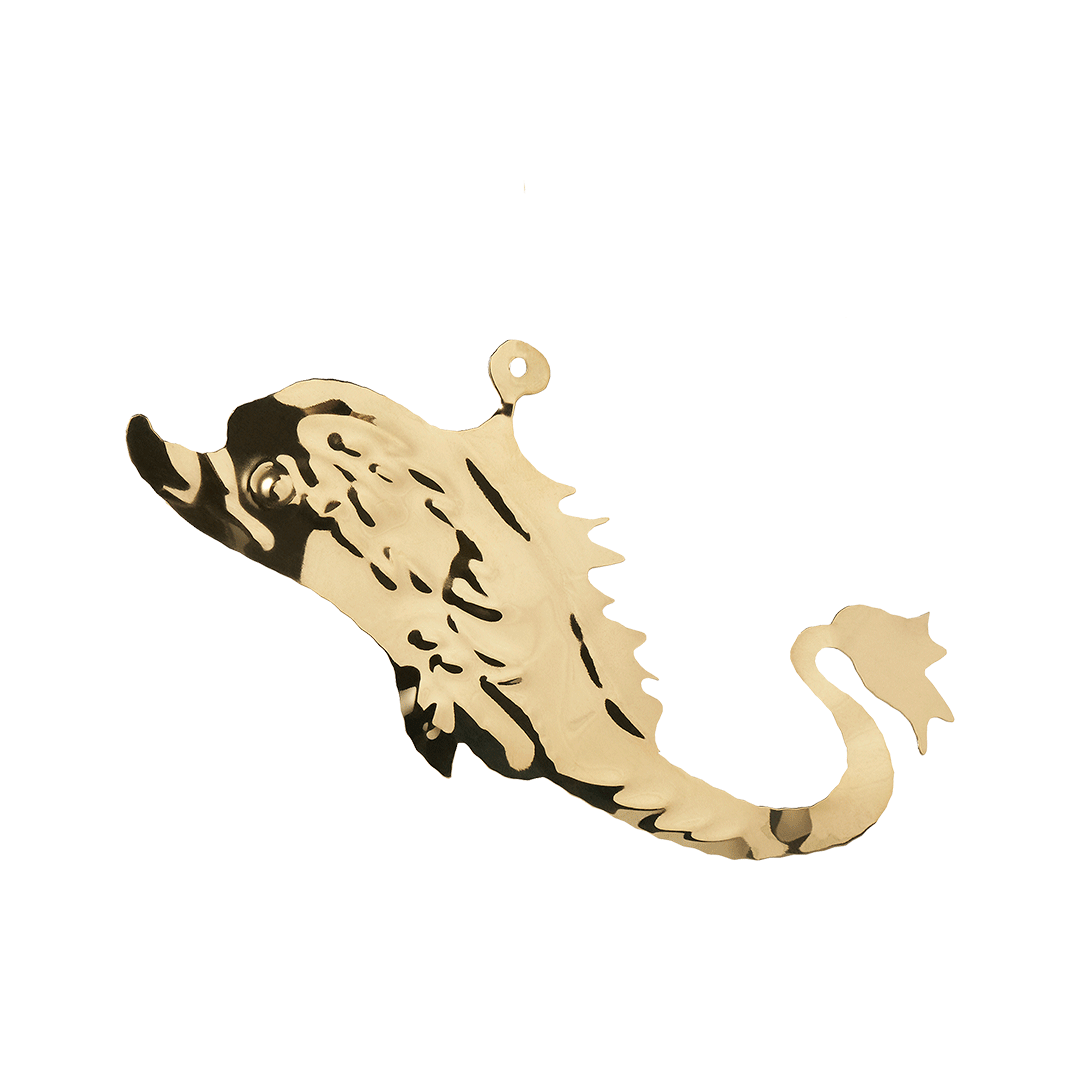 Gold-colored metal ornament in the shape of a seahorse.