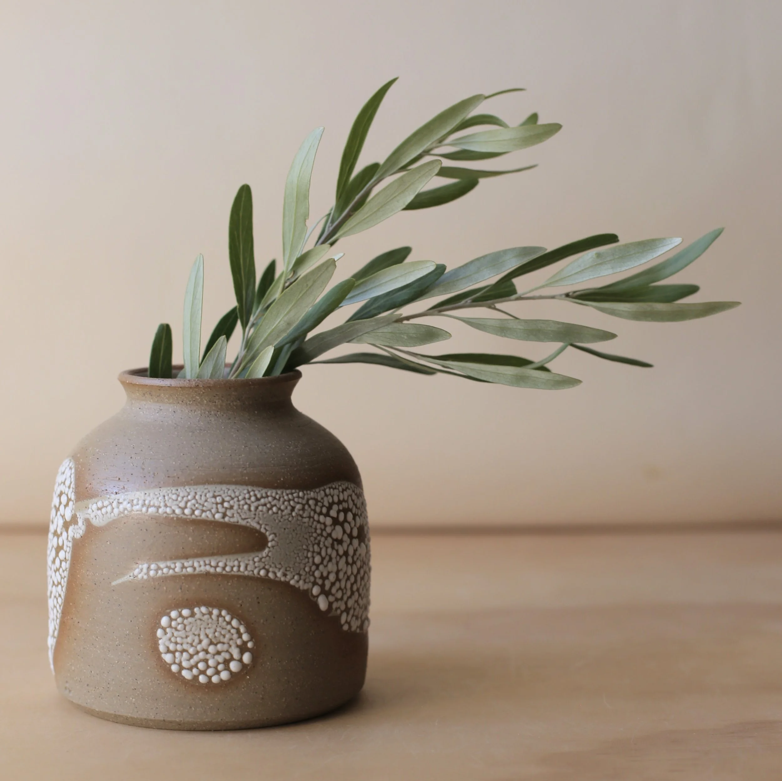 Earthy brown ceramic curve vase